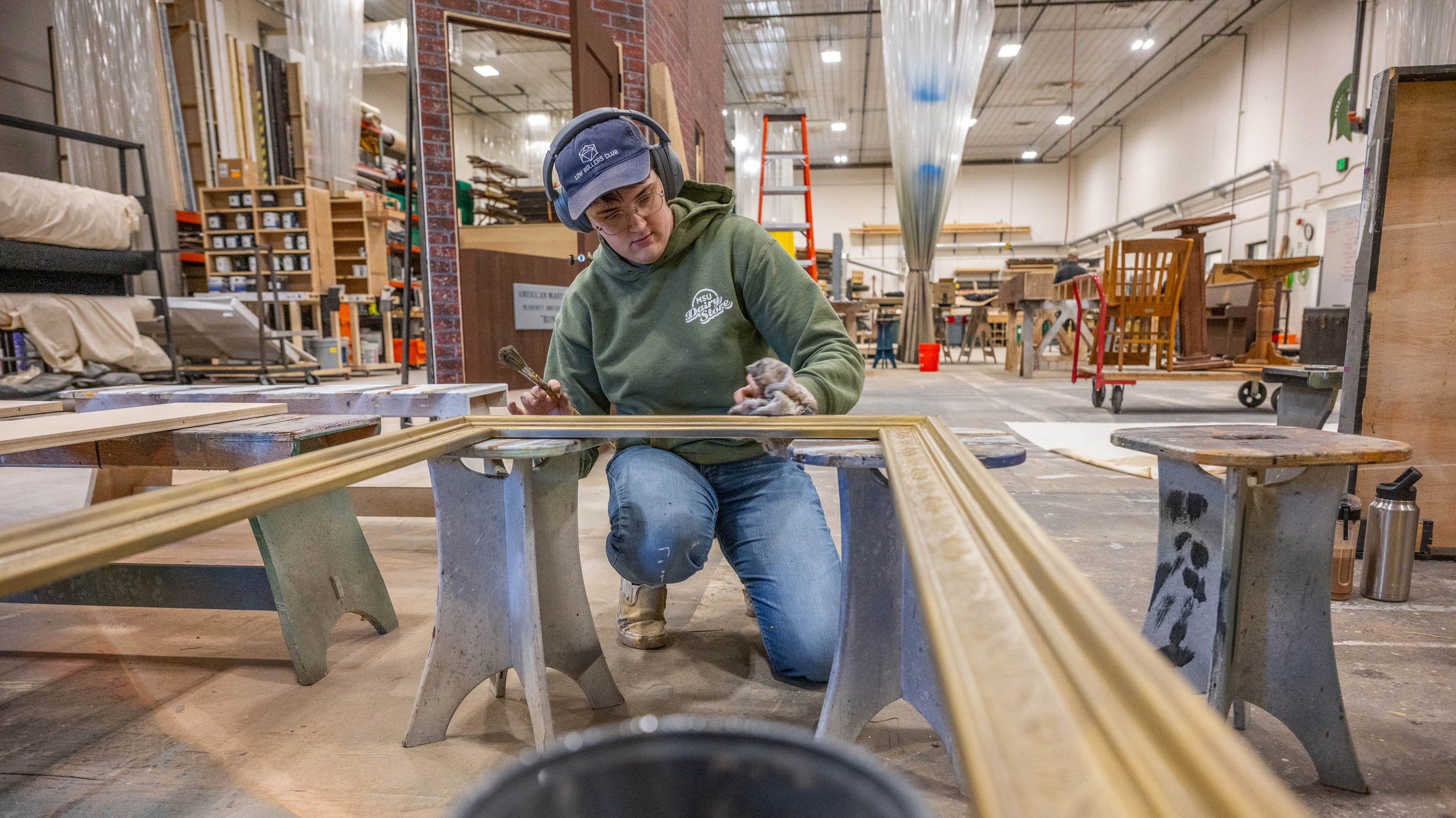 Person building prop in MSU Scene Shop