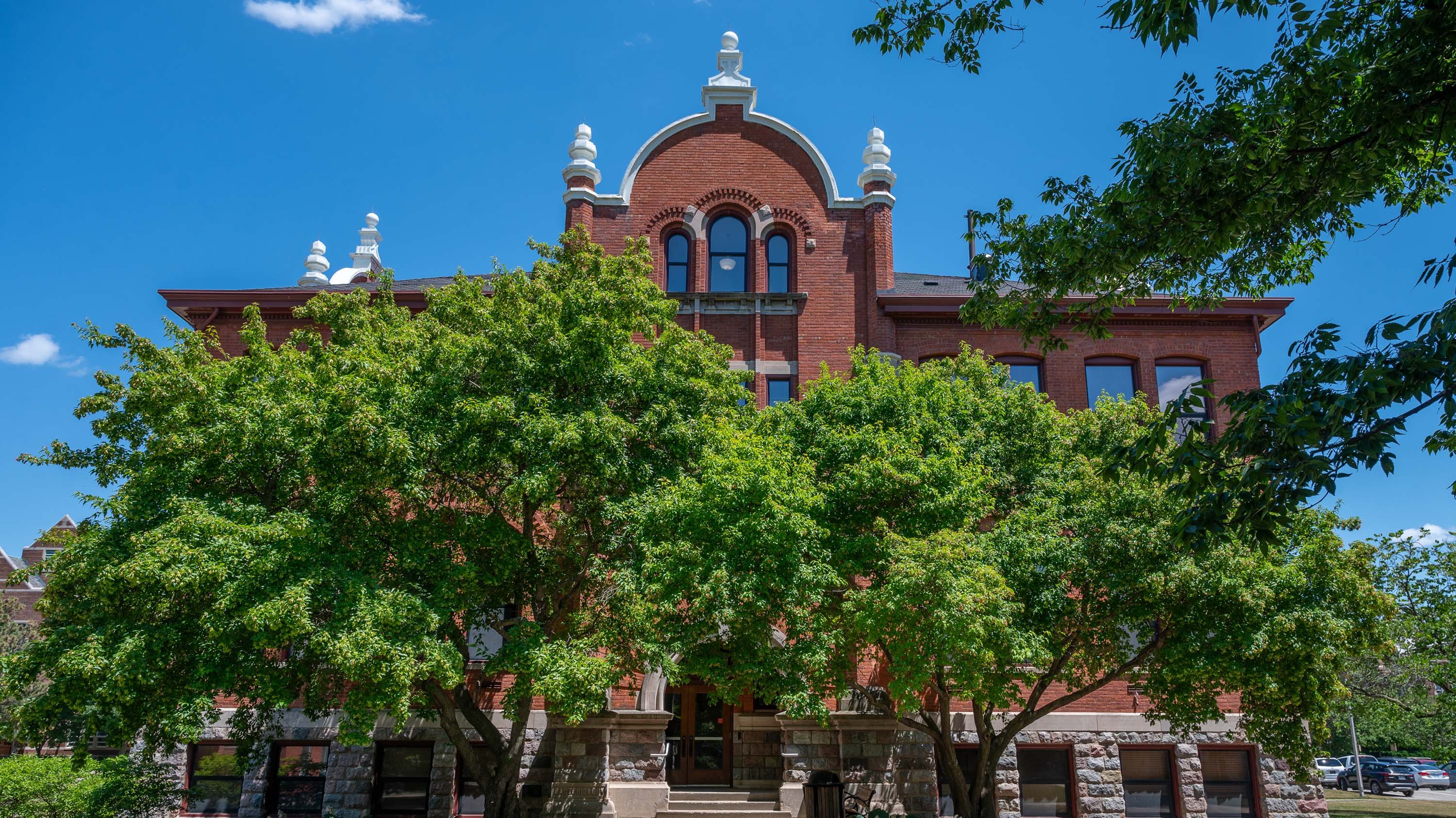 Marshall-Adams hall behind trees