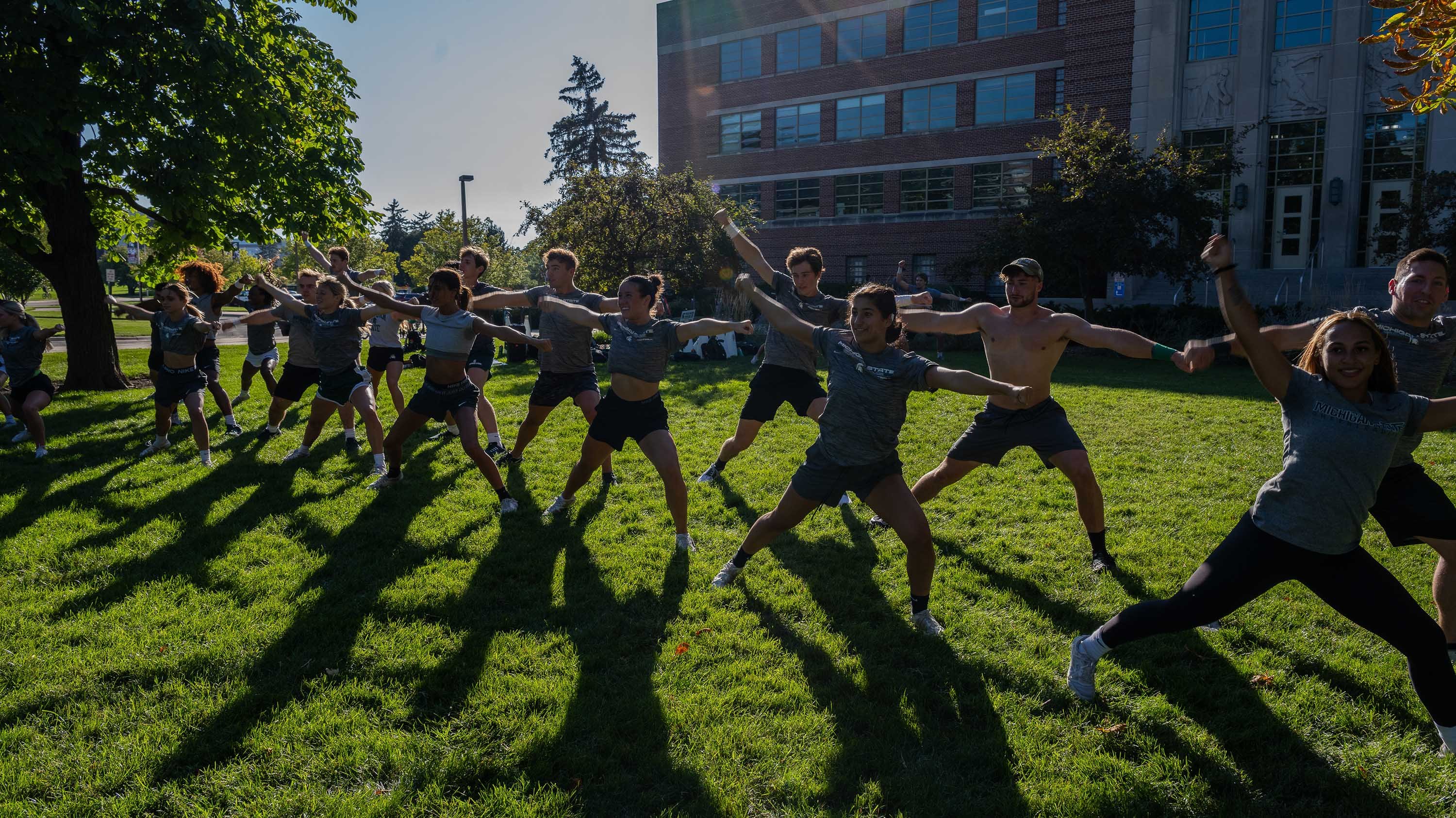 MSU Cheerleading team at sunset