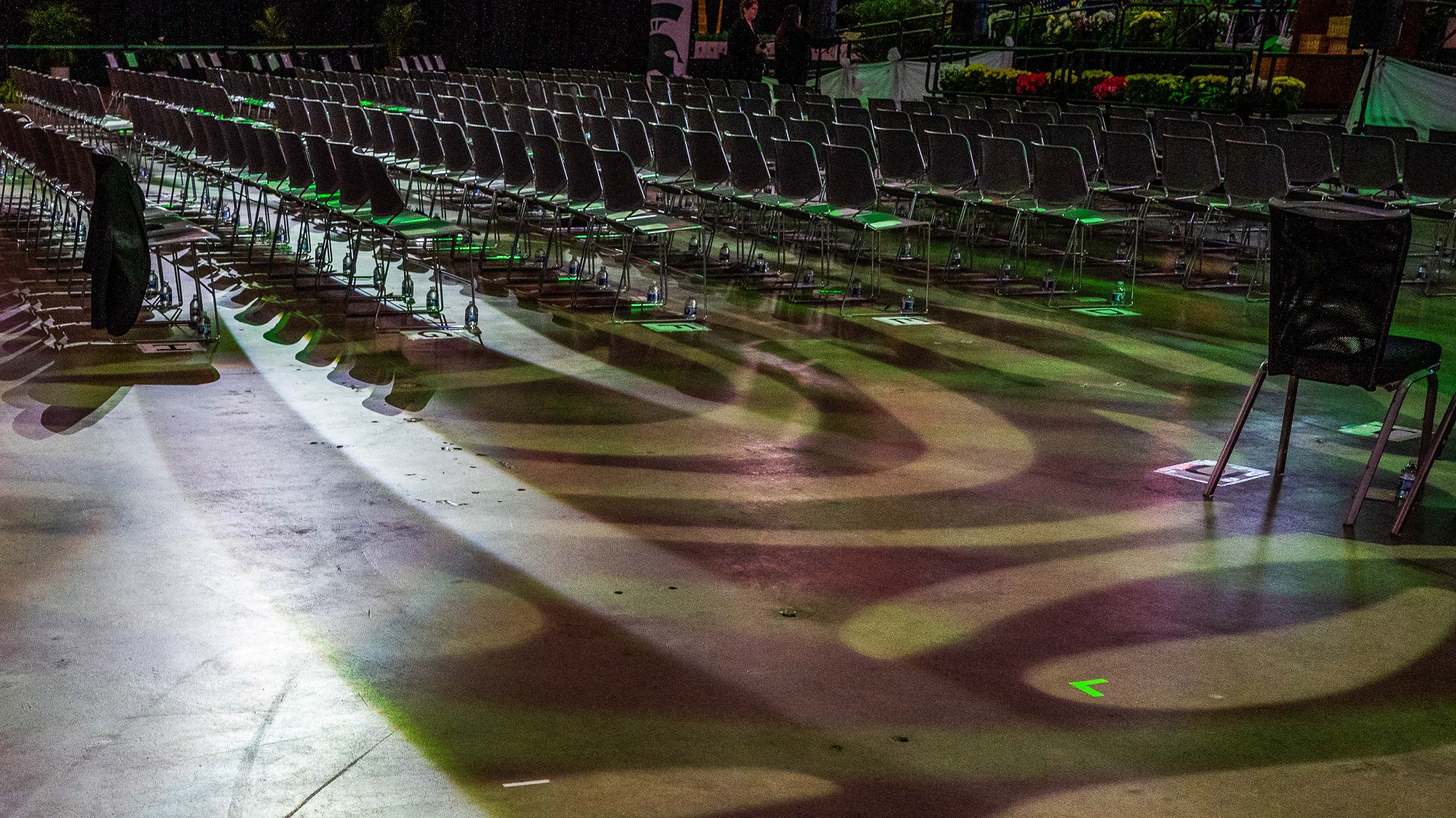 Shadows and light patterns on ground in Breslin Center before commencement