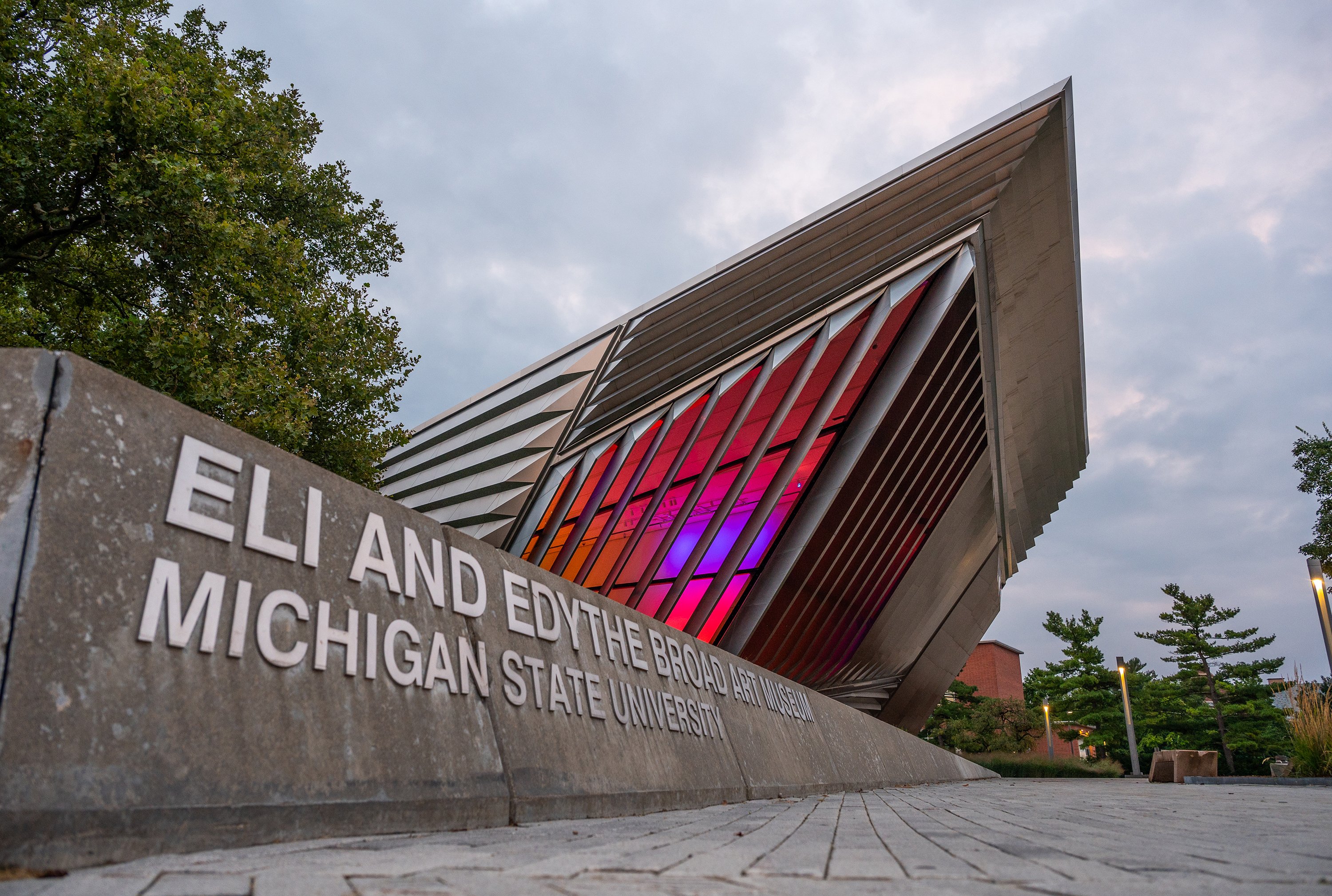 MSU Broad Art Museum with red and purple lights inside the building.