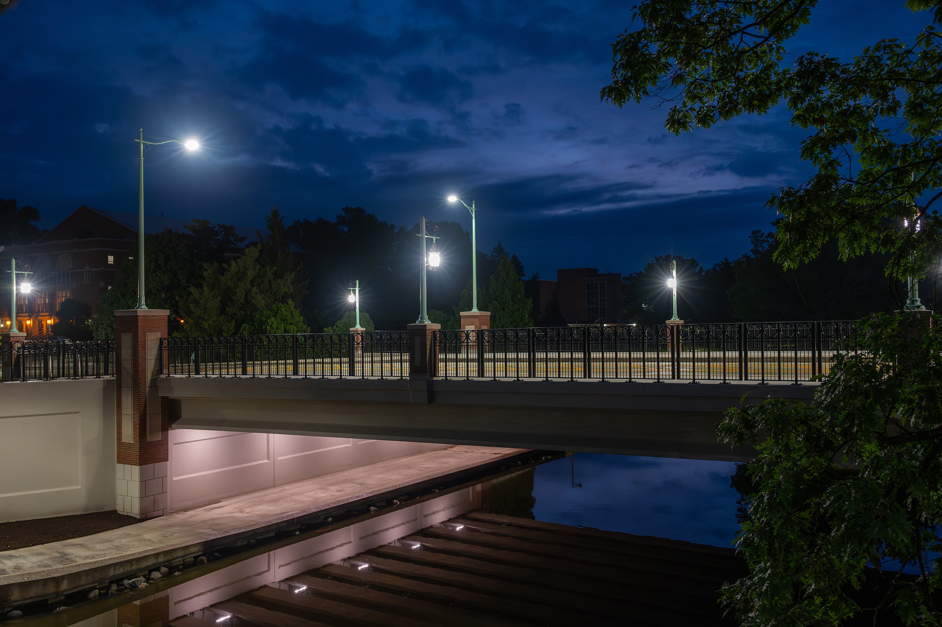 Farm Lane bridge at dawn with lamp posts lit up.
