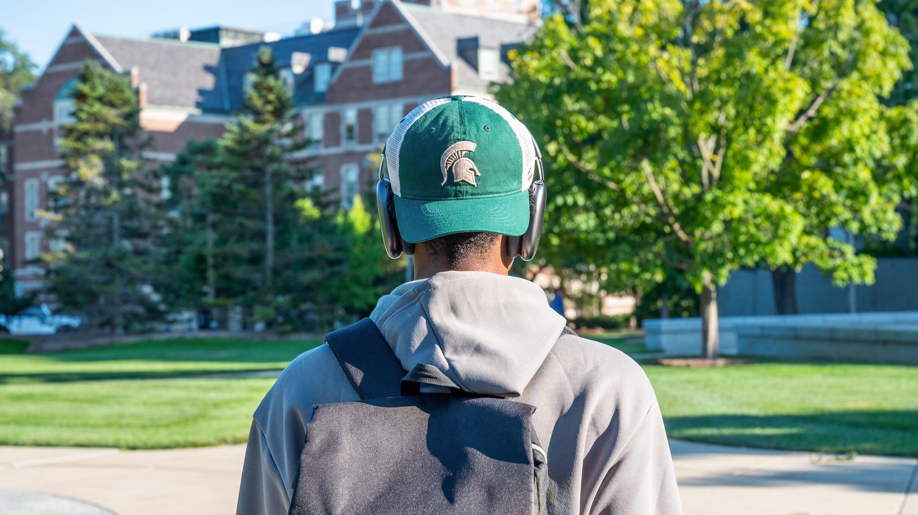 Person wearing Spartan baseball cap