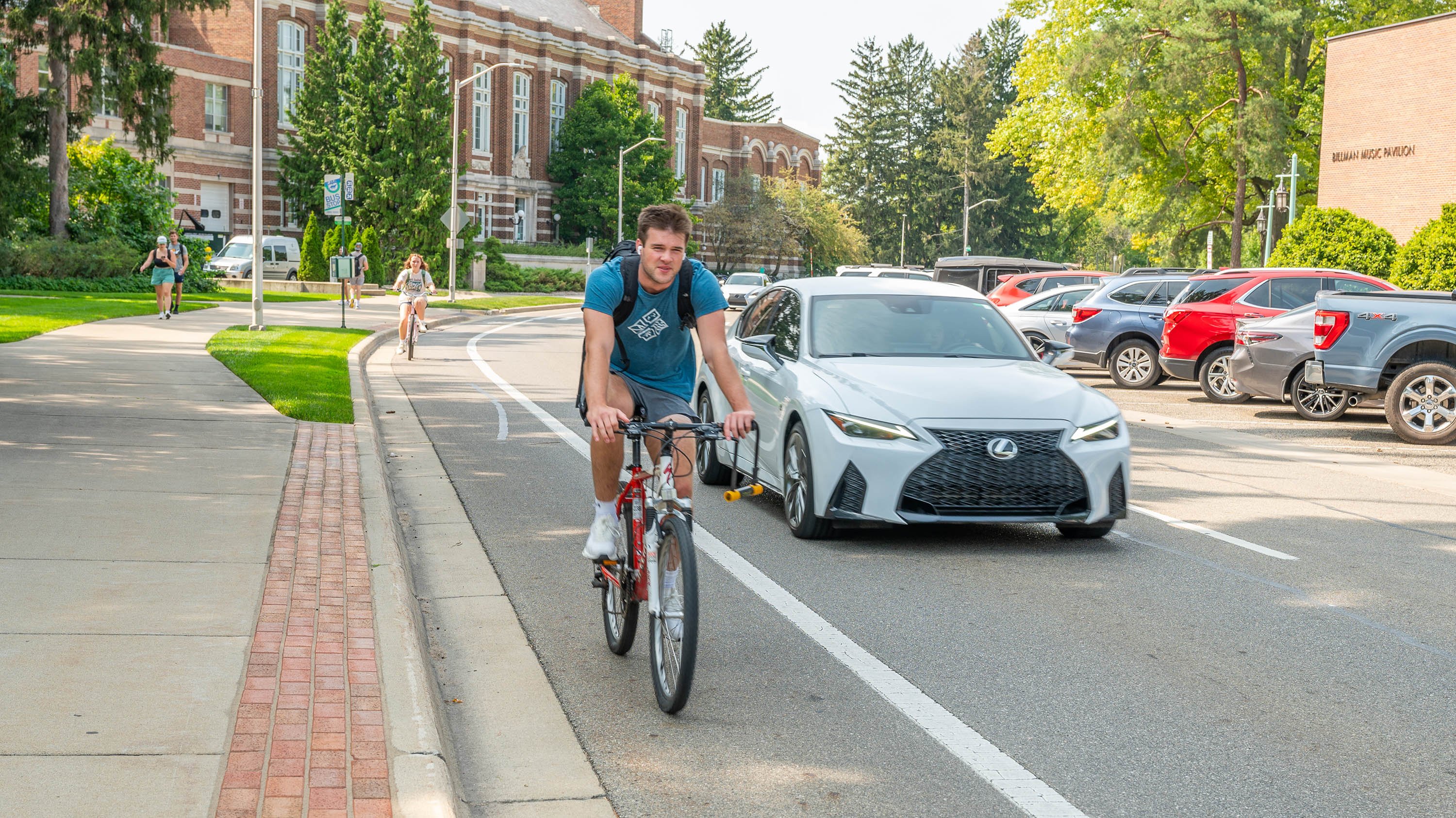 People biking on campus