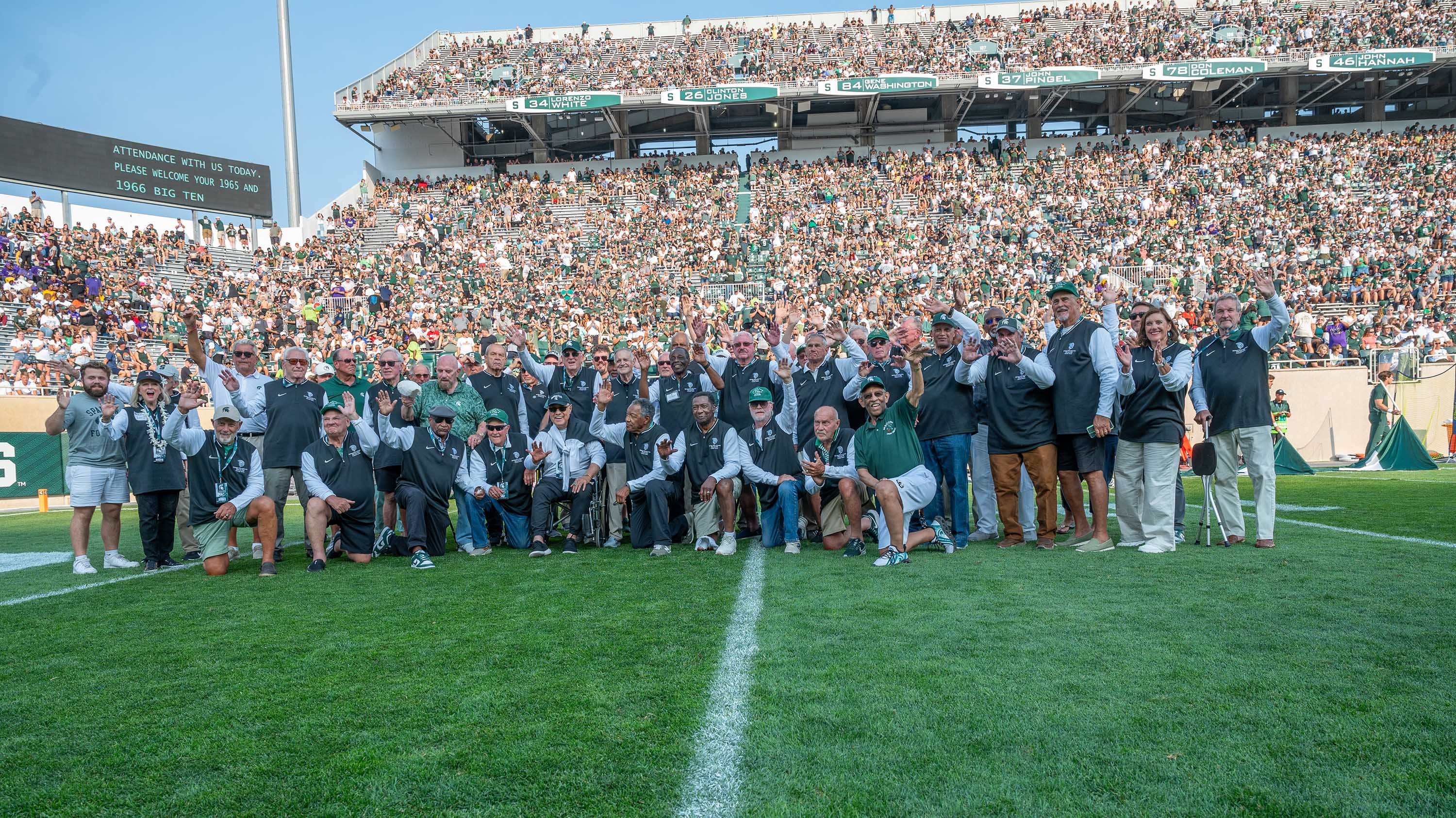 Hall of Fame inductees on the field at Spartan Stadium