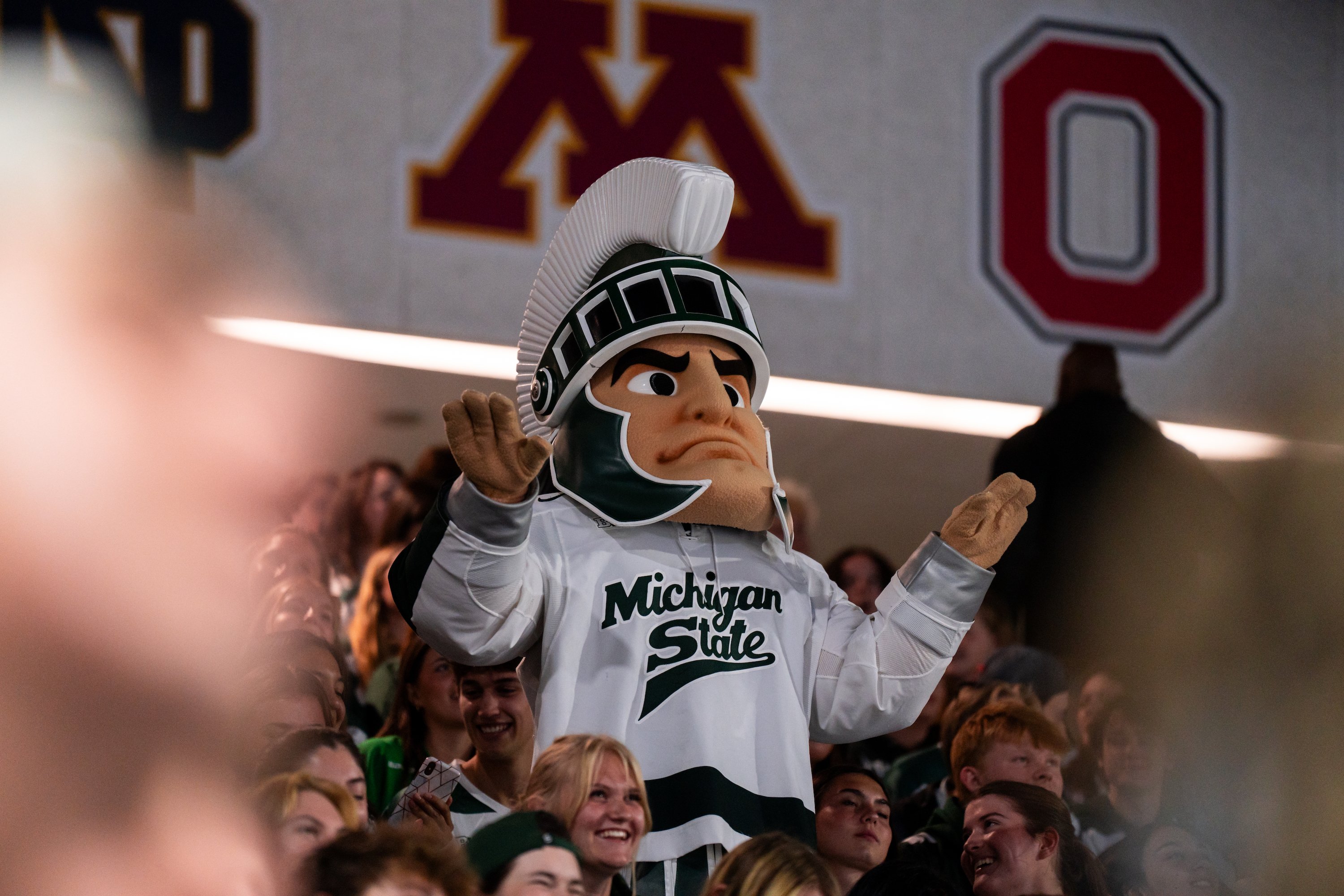 Sparty the mascot sits among the crowd at Munn Ice Arena.