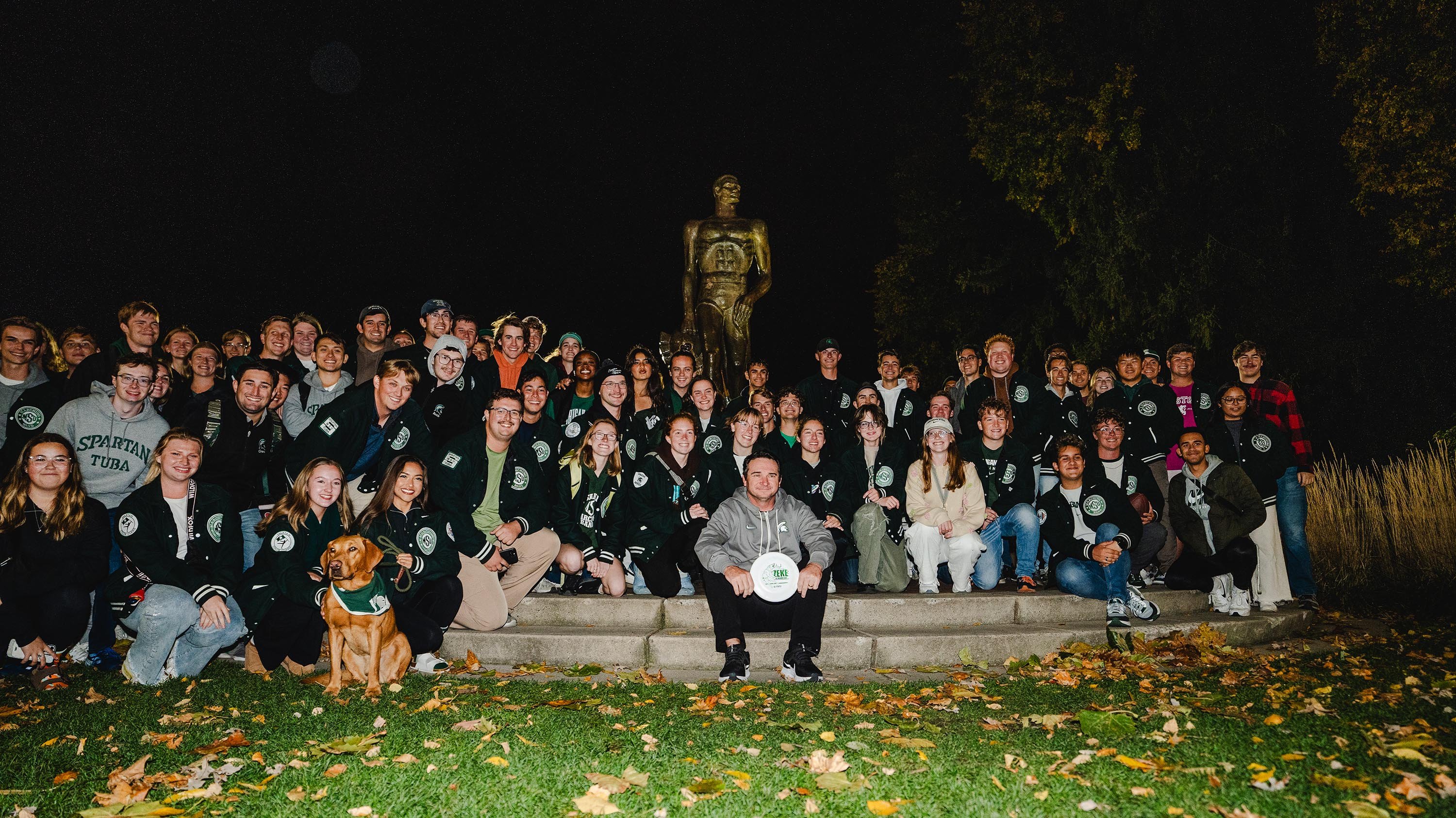 Members of the Spartan Marching Band posing in front of The Spartan