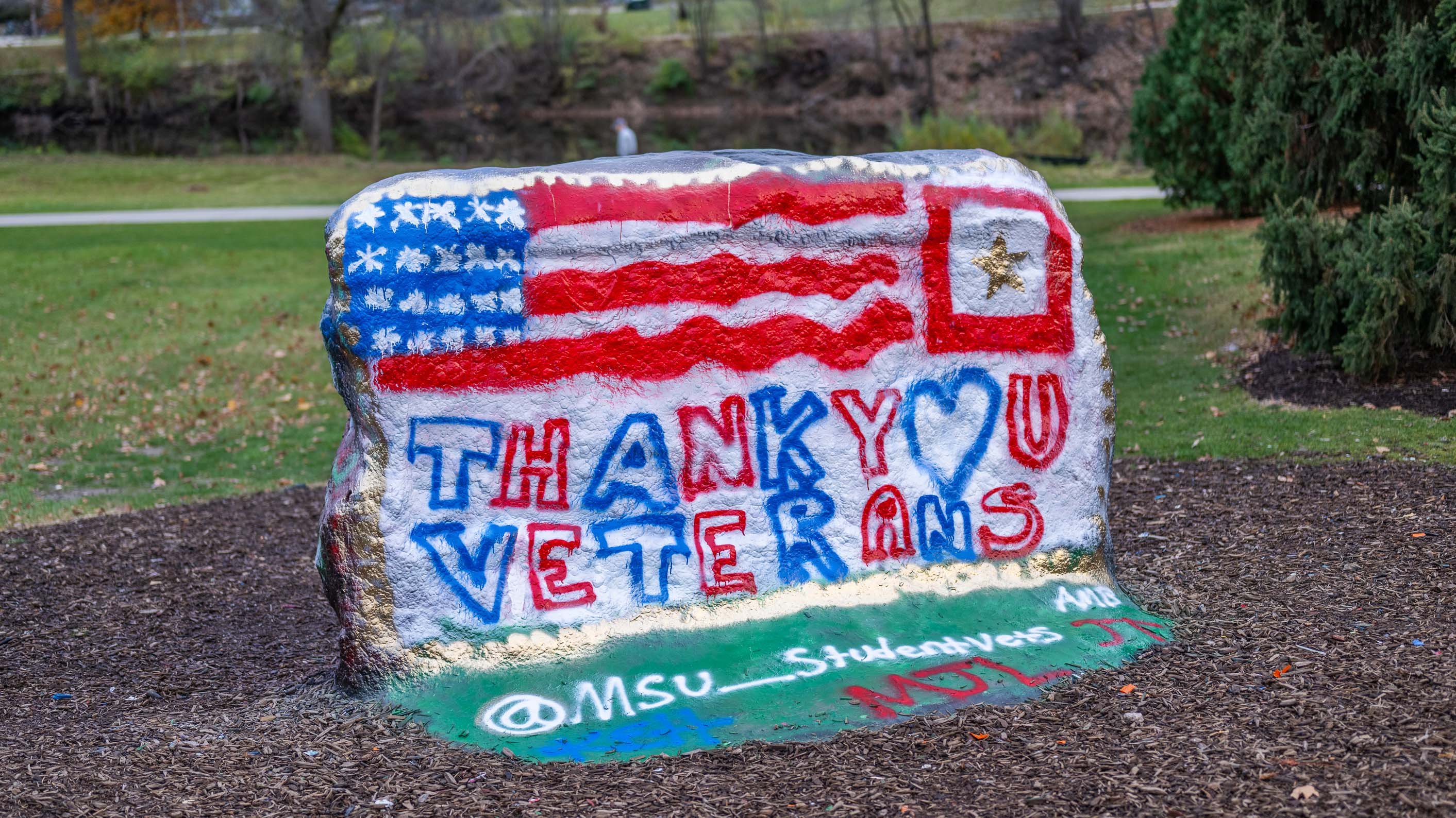 The MSU Rock painted with an American flag, the text 'thank you veterans' and the instagram handle msu_studentvets