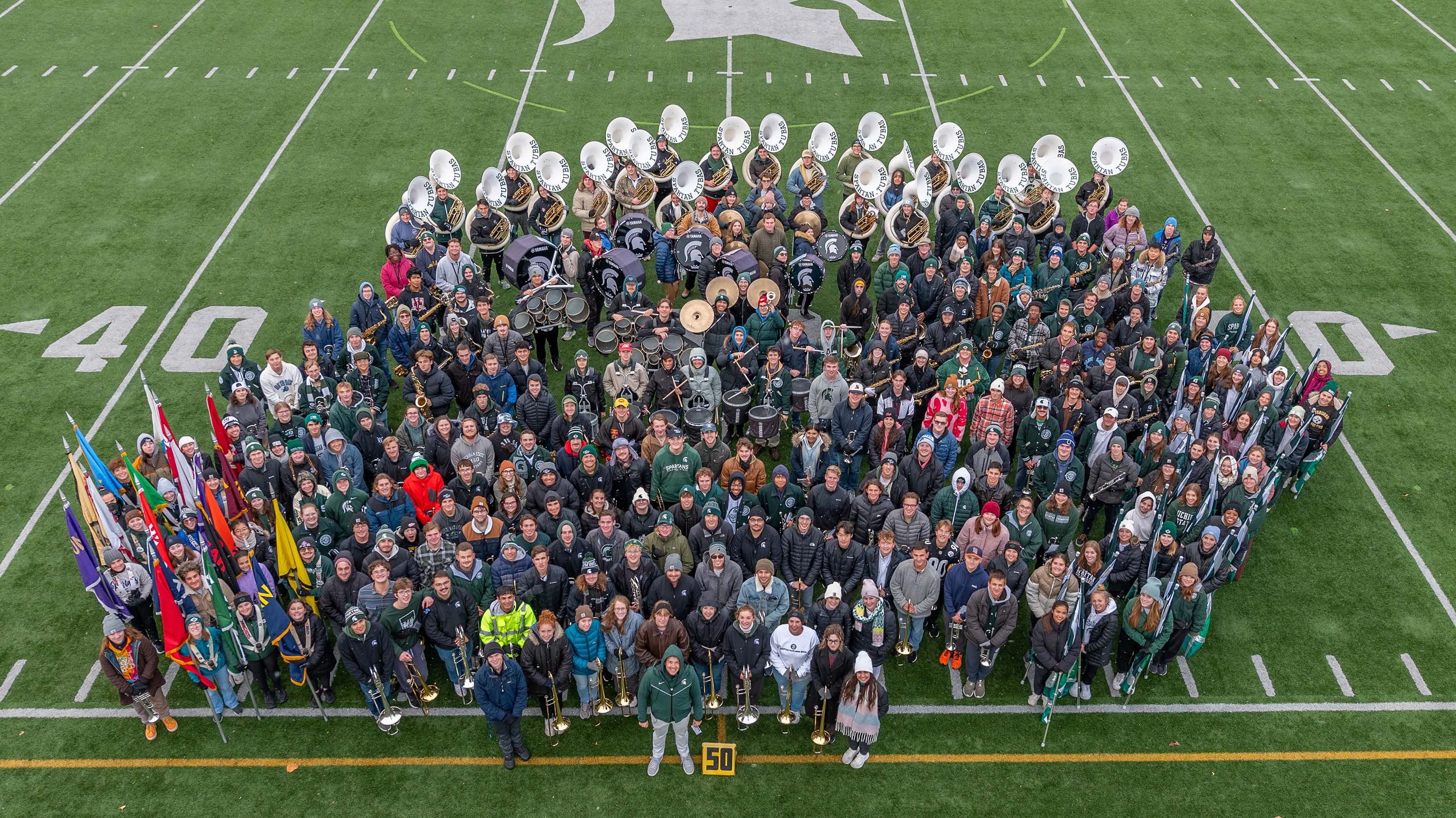 Spartan Marching Band members on field at Spartan Stadium