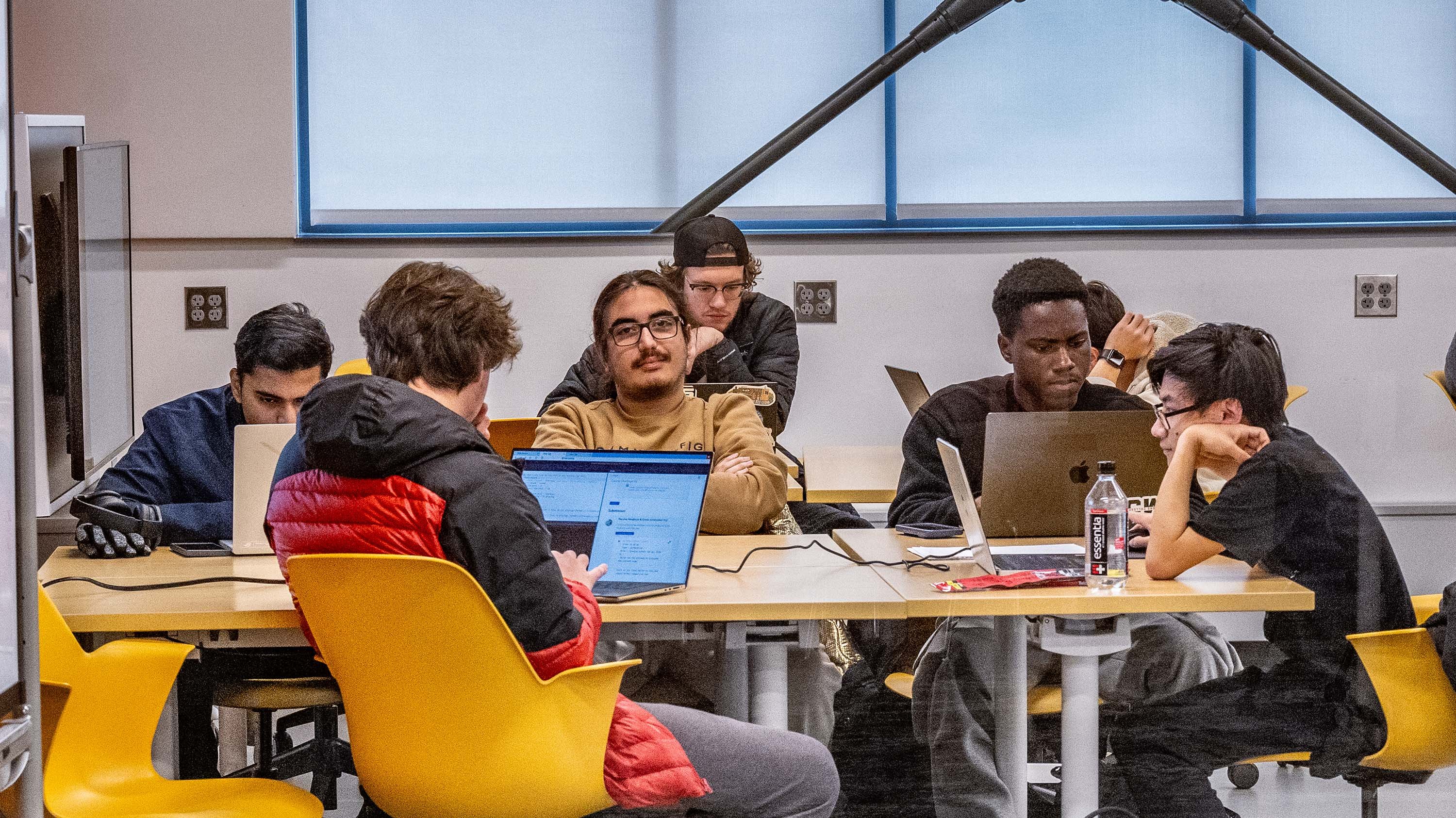 Group of students studying in classroom