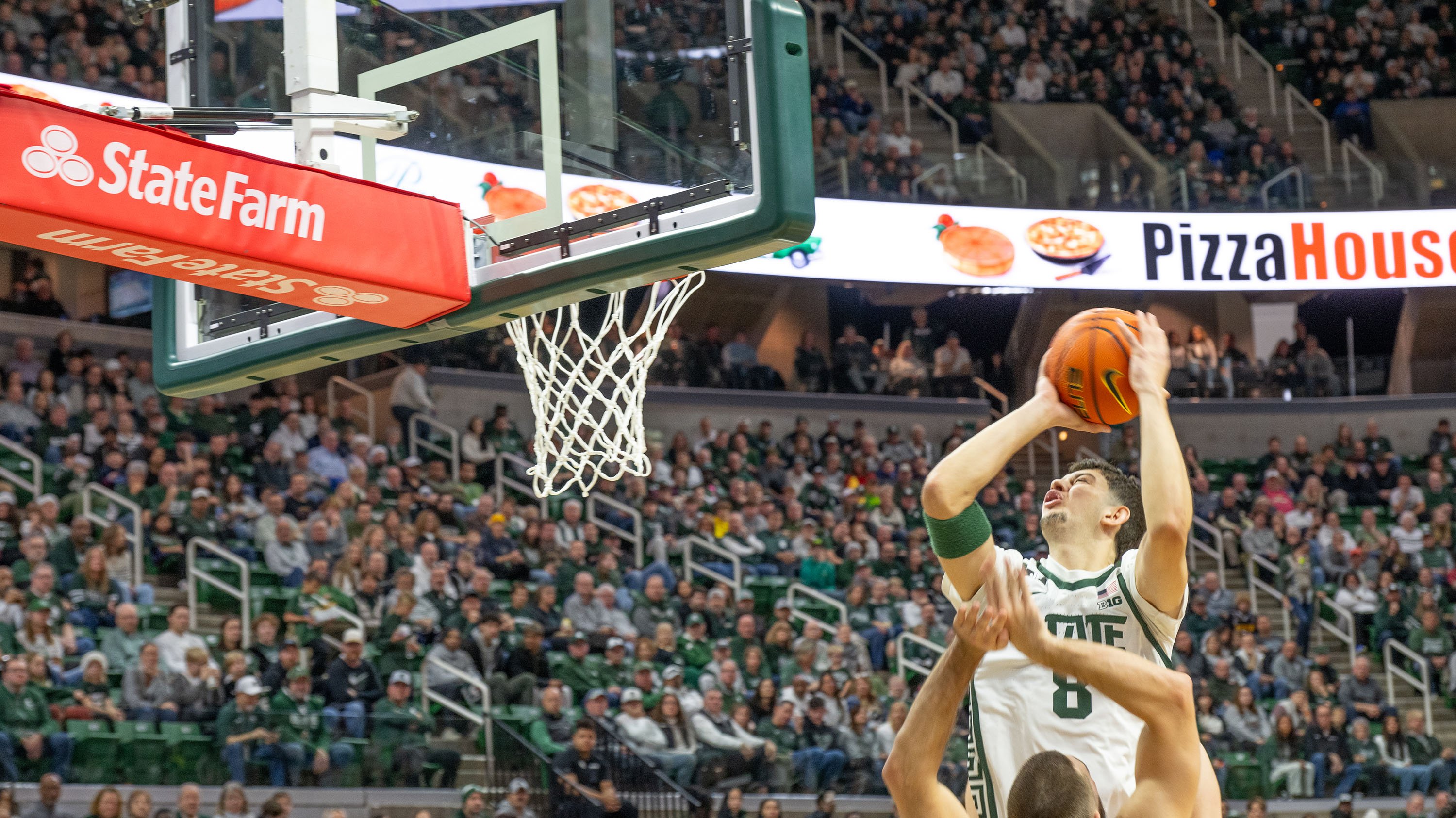 Basketball player attempting to shoot a basket