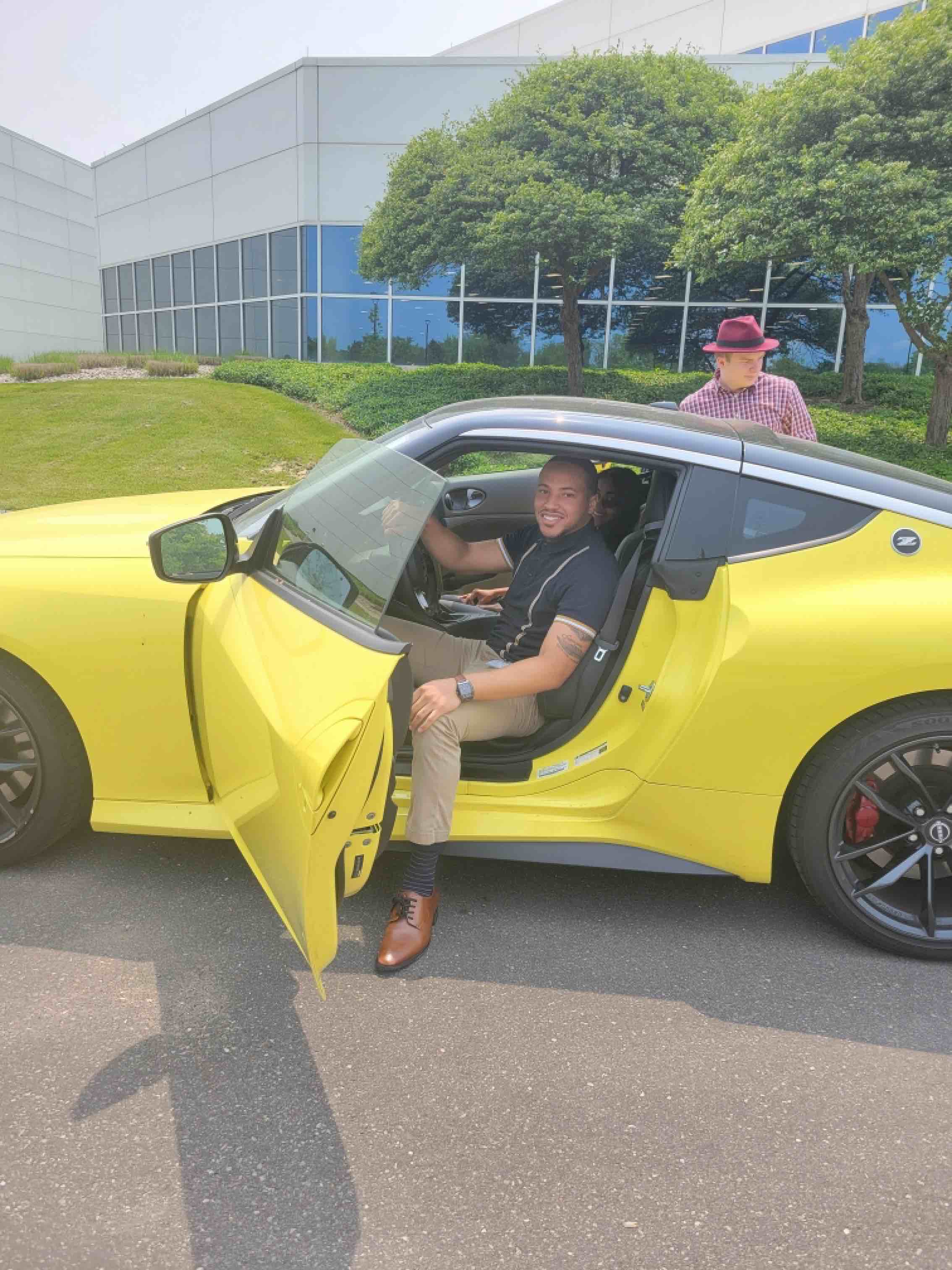 Dauan Hendley Jr. poses inside of a Nissan