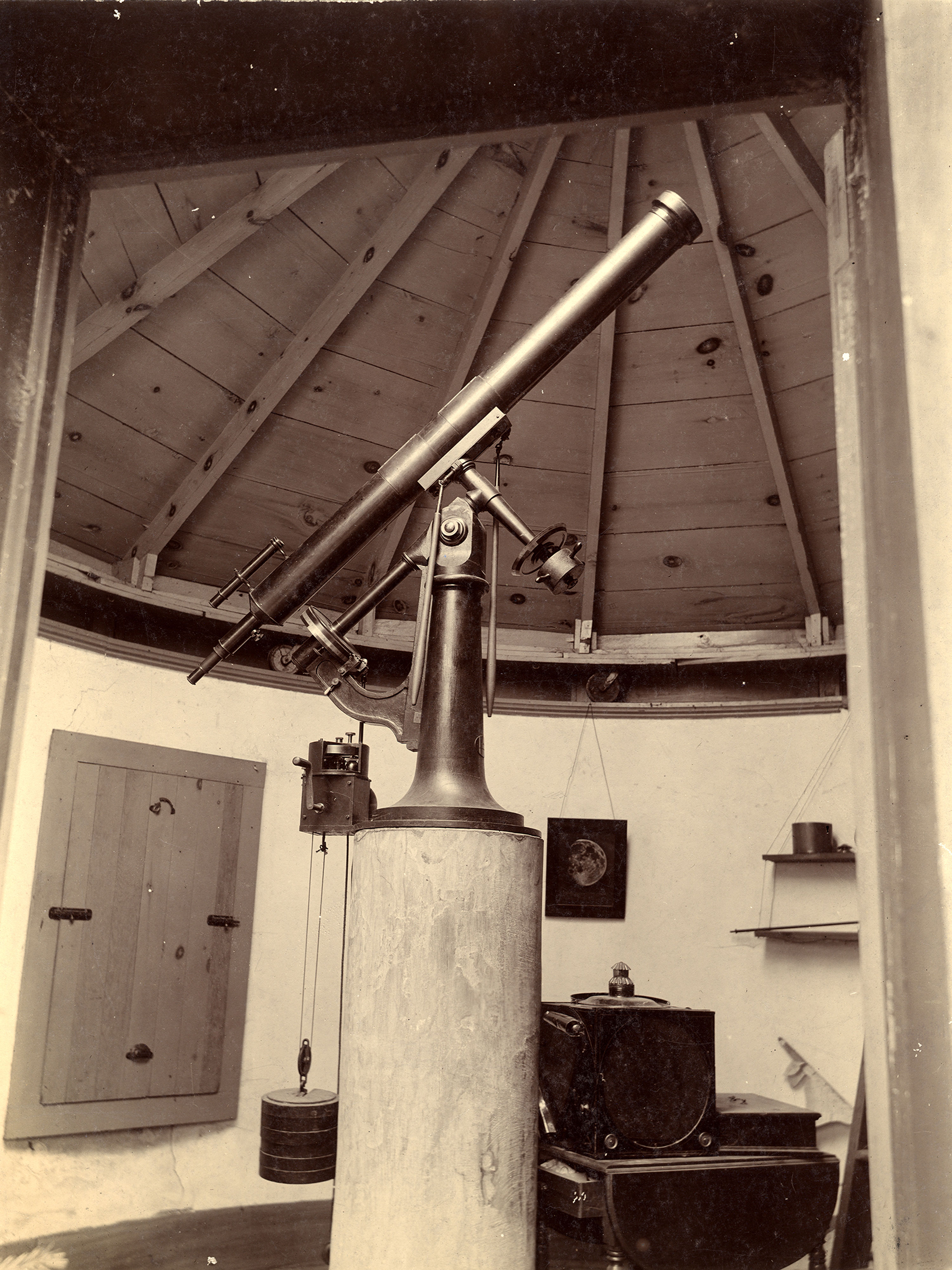 A sepia-toned photo of a telescope