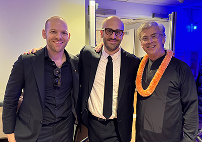 David Biedenbender (center) celebrates with University of Texas Wind Ensemble Conductor Jerry Junkin (right) and trumpet soloist Caleb Hudson