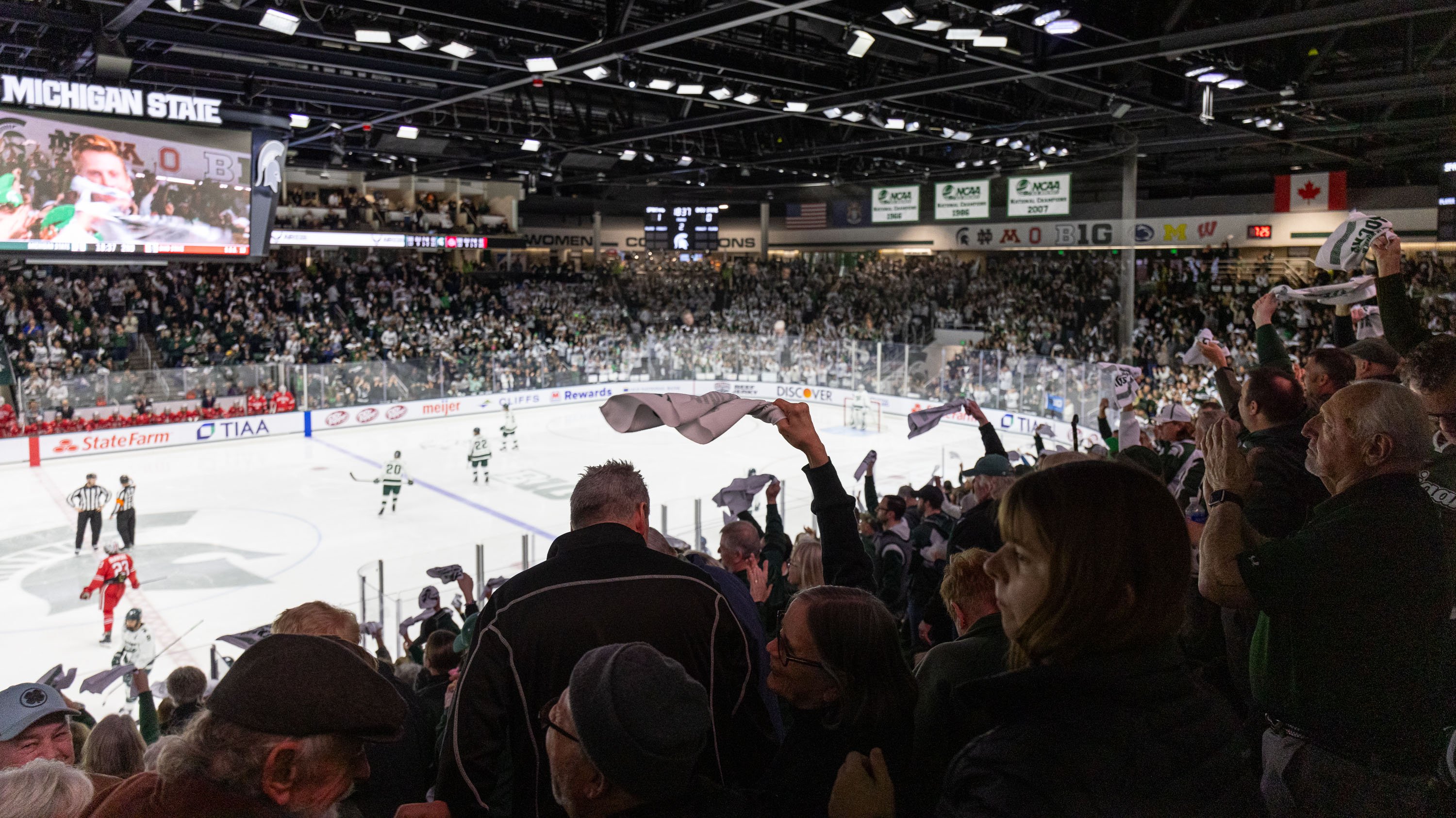 Crowd during hockey game at Munn