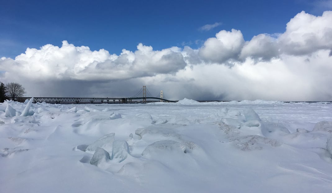 A view of the Mackinac Bridge from a frozen shore