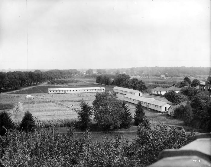 A view of the M.A.C. barracks built on campus during WWI.