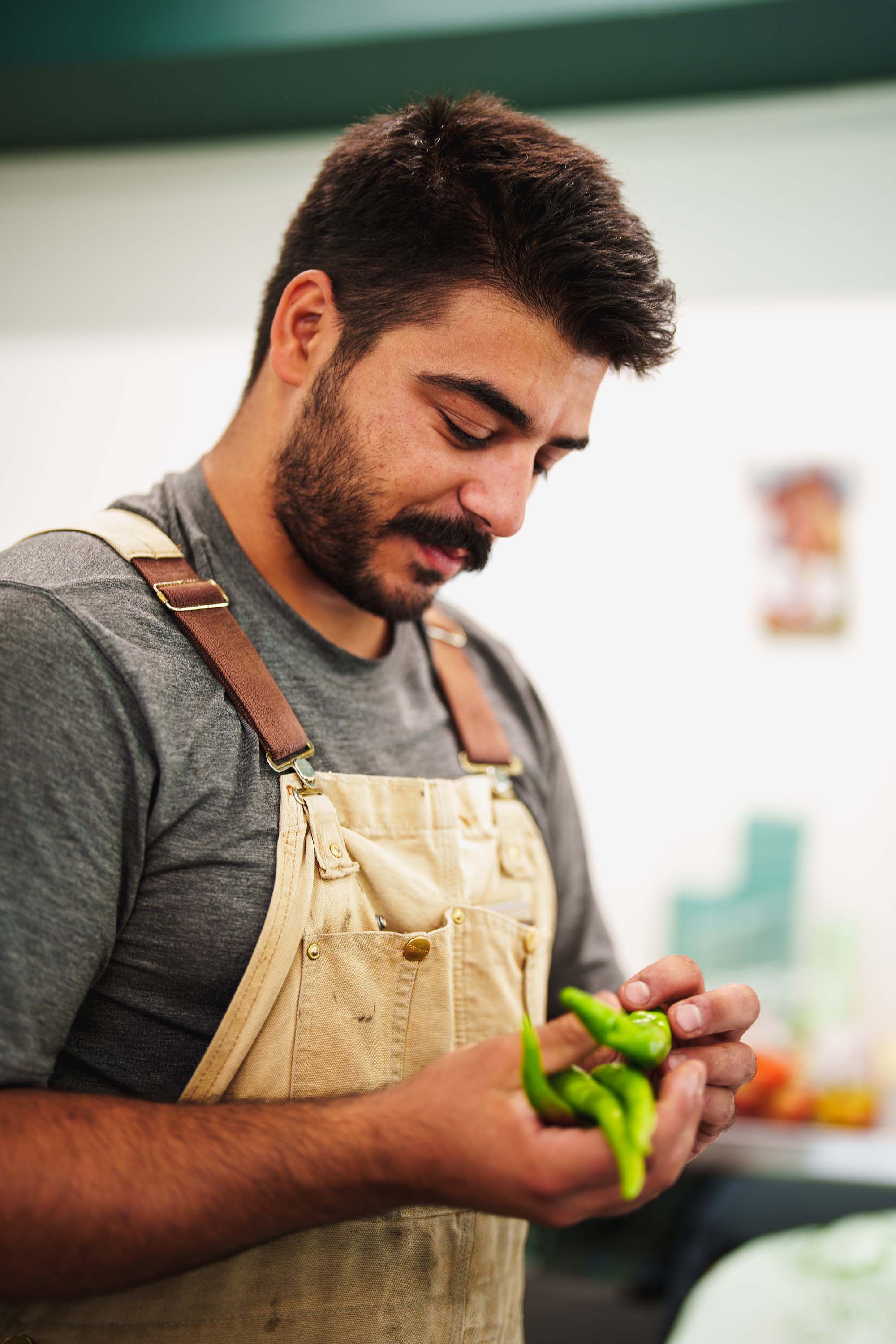 Person holding peppers