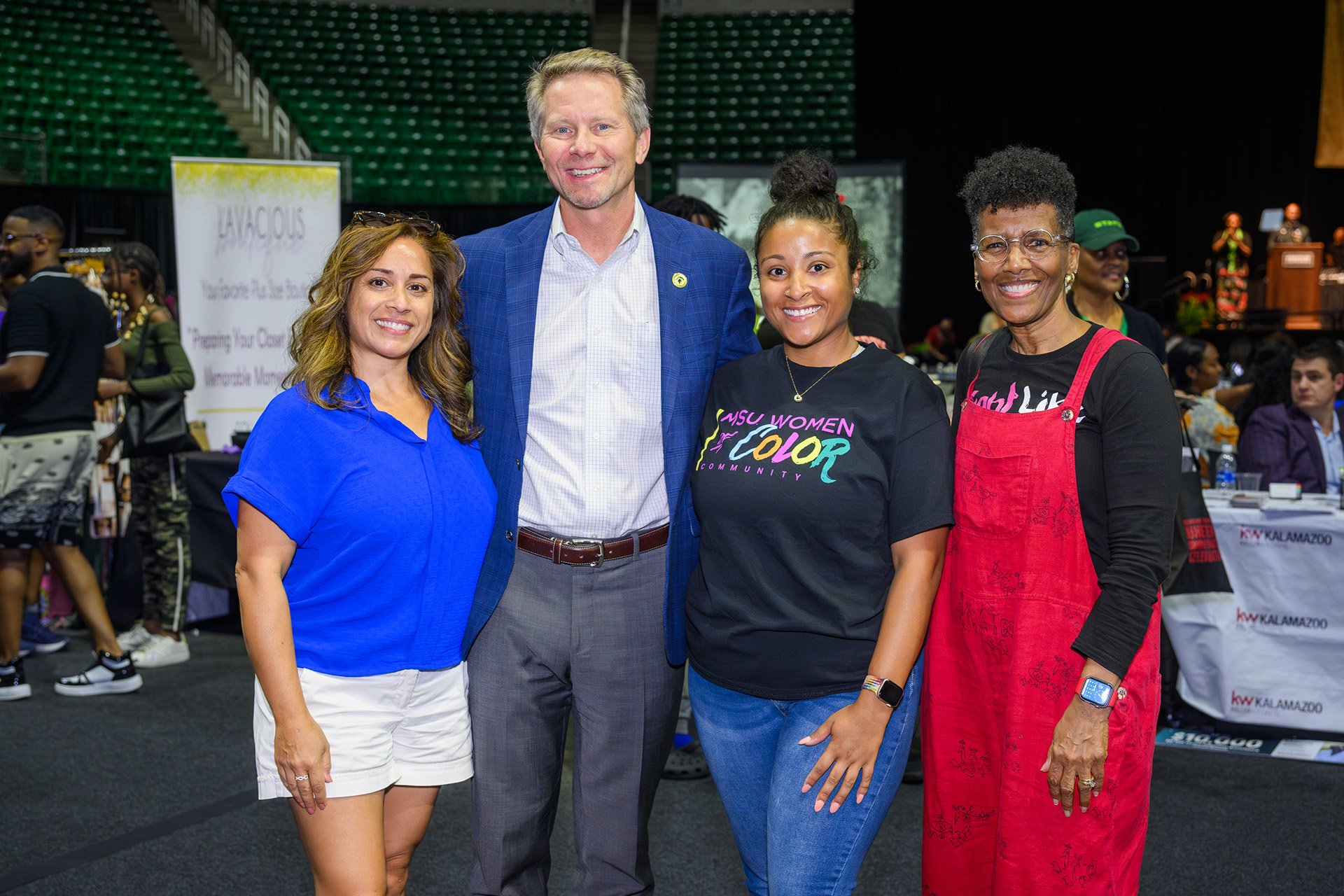 President Guskiwiecz takes a photo with MSU staff