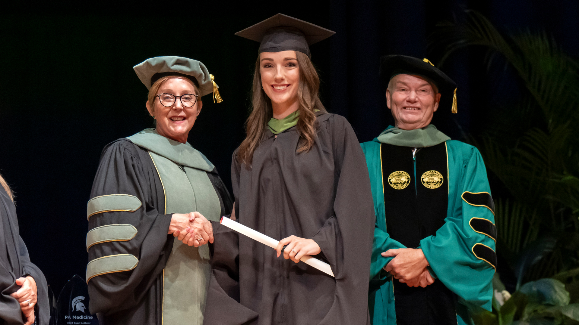 MSU College of Osteopathic Medicine, or COM, Dean Joyce deJong and Scott Carlson, medical director and associate professor in the Department of Physician Assistant Medicine, congratulated each of the graduates at commencement. Photo courtesy of Steve Jessmore Photography.