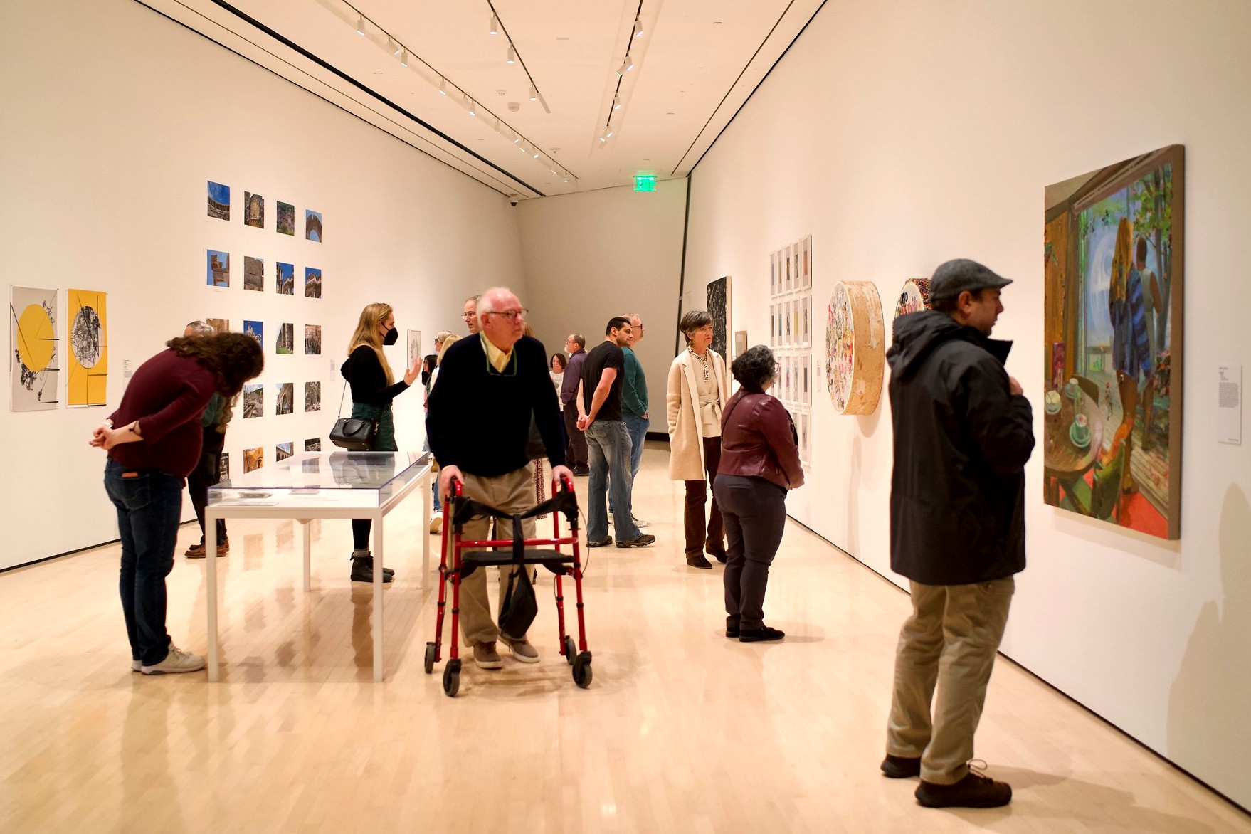 People viewing artwork in a gallery.
