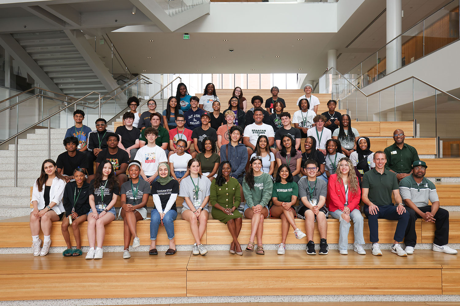 Group photo of people posing on a set of large steps.