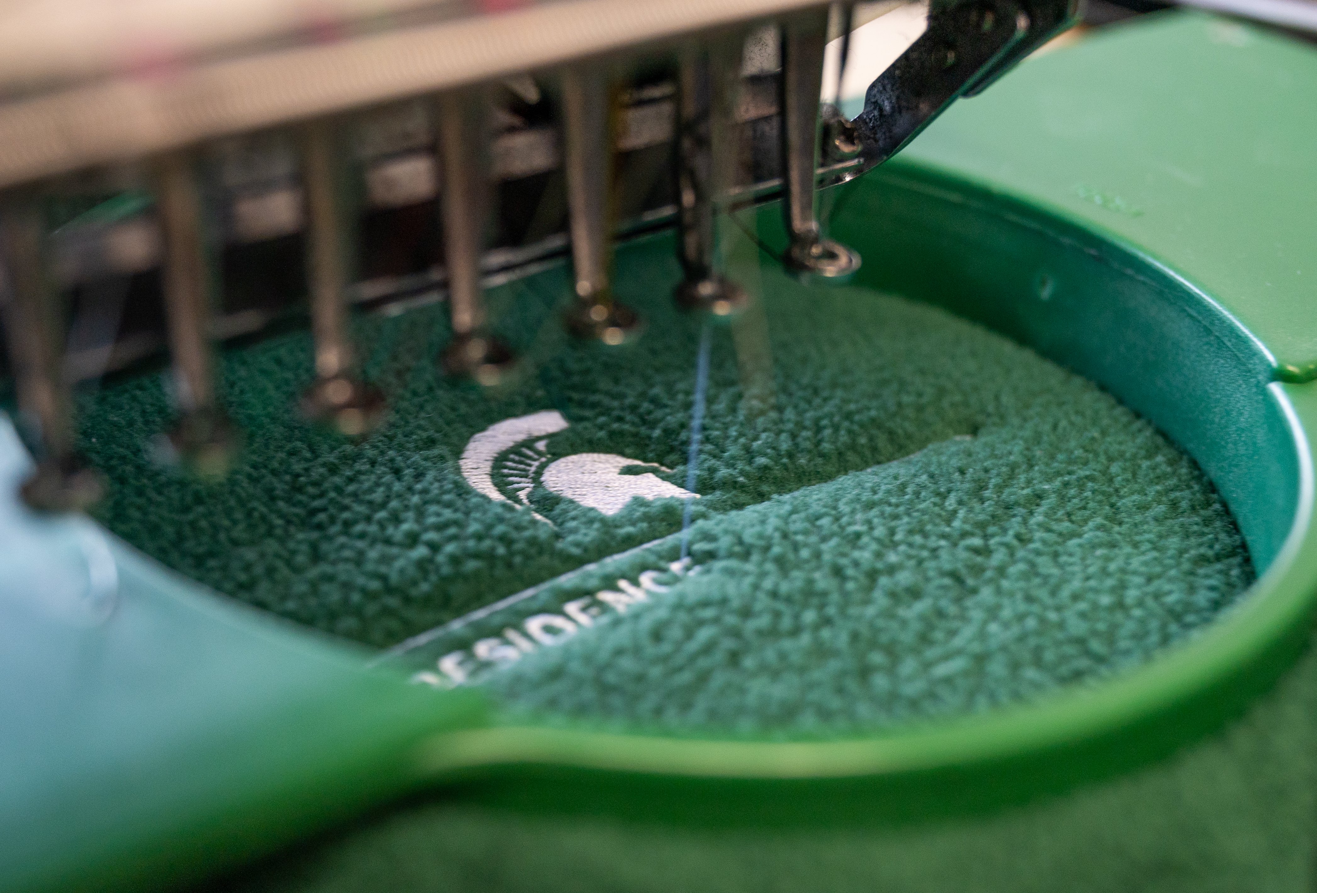 Quality control check, by careful picking away loose fabric.