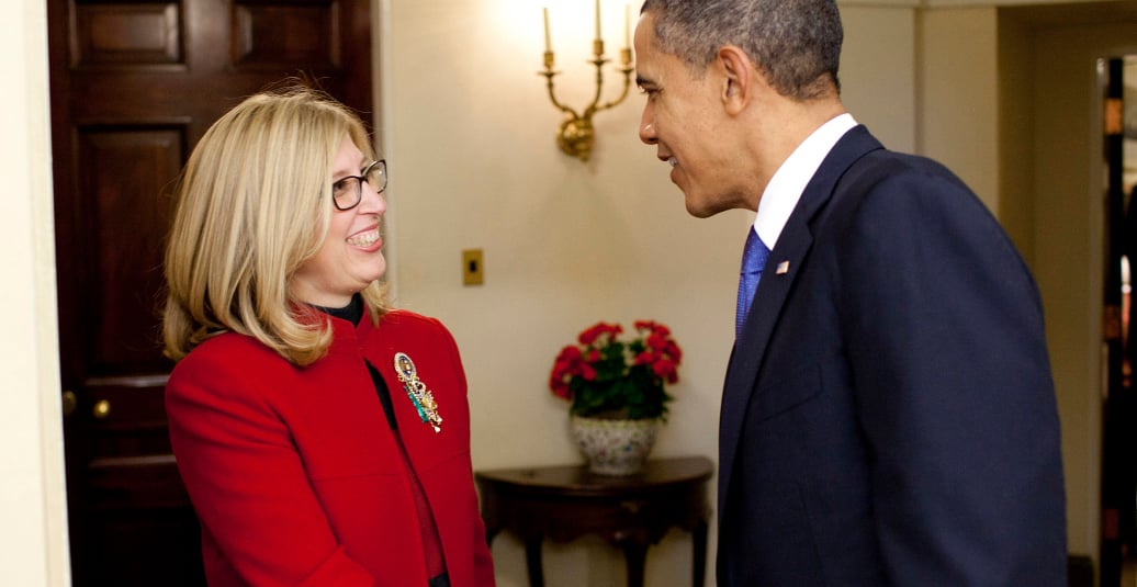 Then-President Barack Obama presents Teresa K. Woodruff with the Presidential Award for Excellence in Science, Mathematics and Engineering Mentoring in an Oval Office ceremony in 2011. Photo credit: Photo credit: Pete Souza
