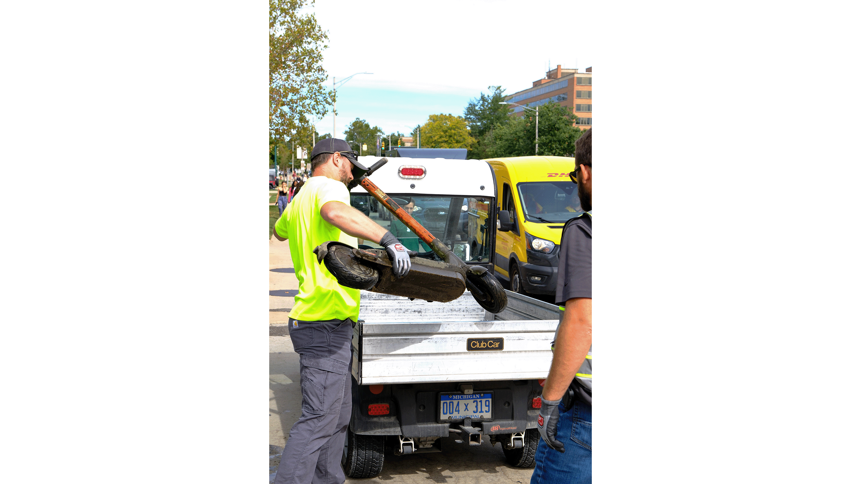 Person removing equipment from truck