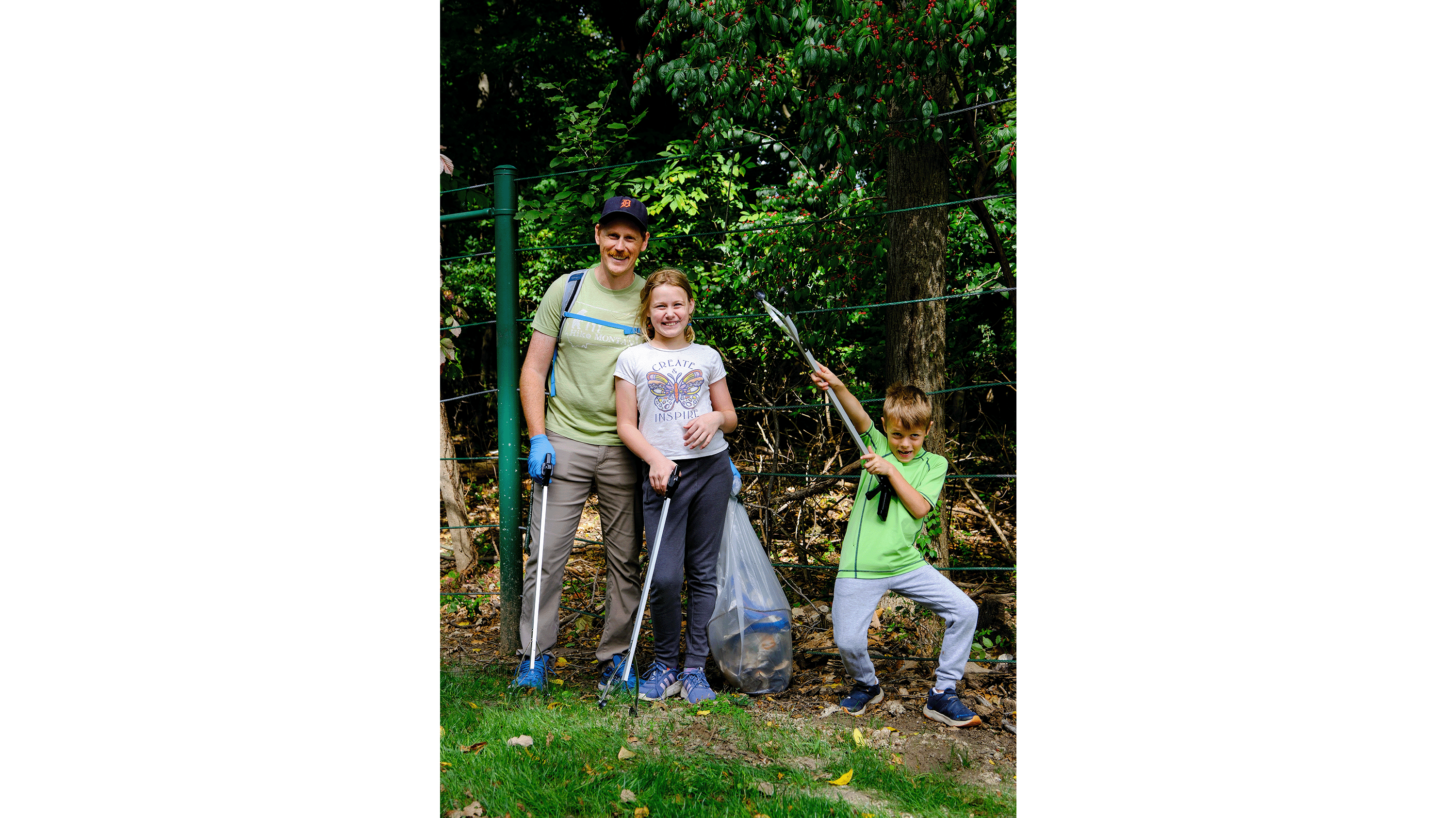 Person and children with cleanup equipment
