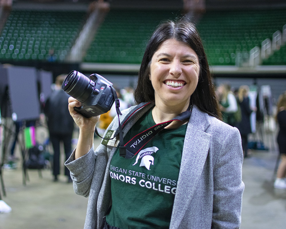 Melanie Brender with photos at UURAF