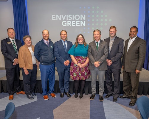 Members of the leadership teams from Lansing Community College, MSU, and the Lansing School District, alongside Envision Green Program Director Laura Wise.
