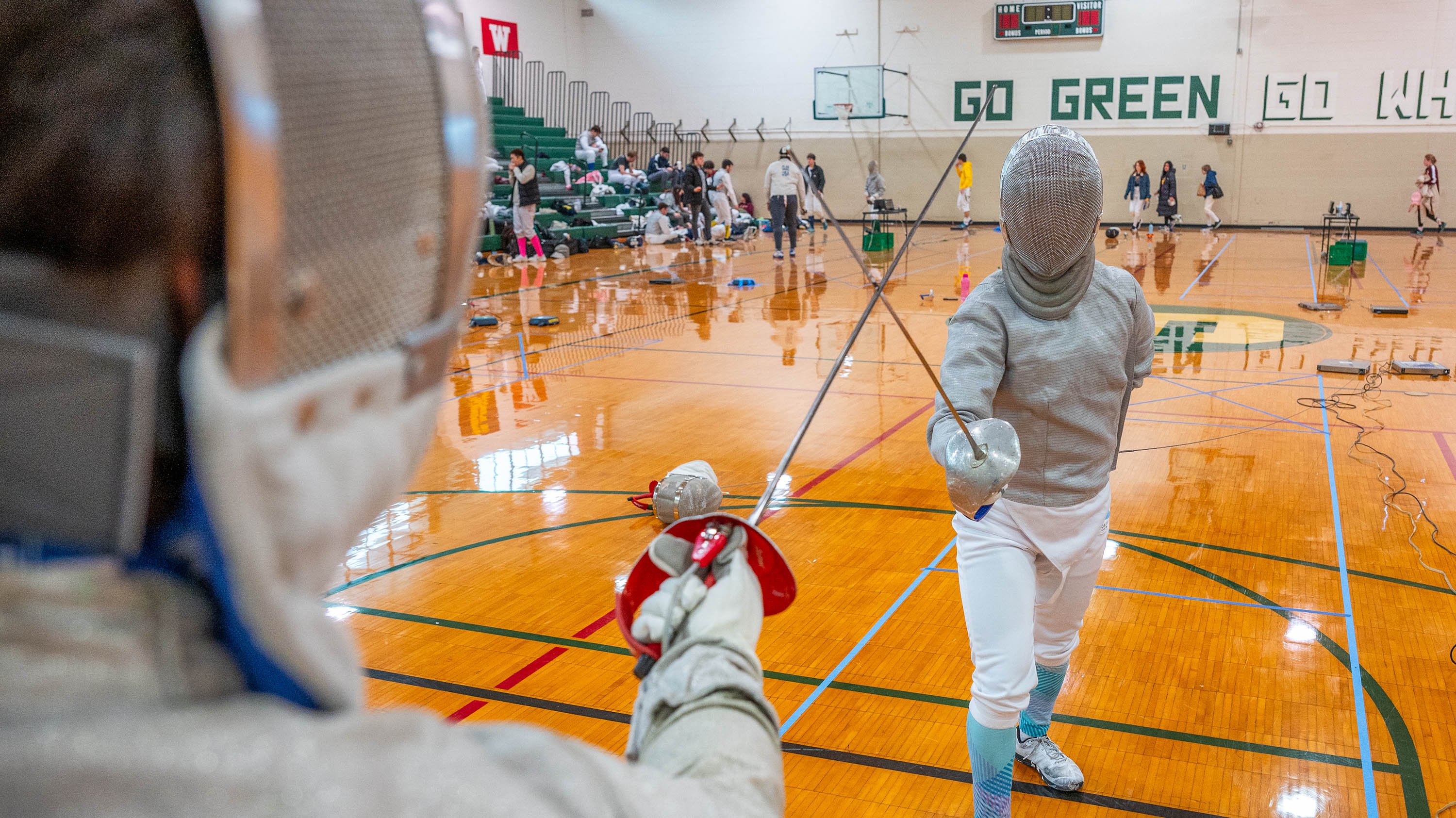 Two fencers in a match