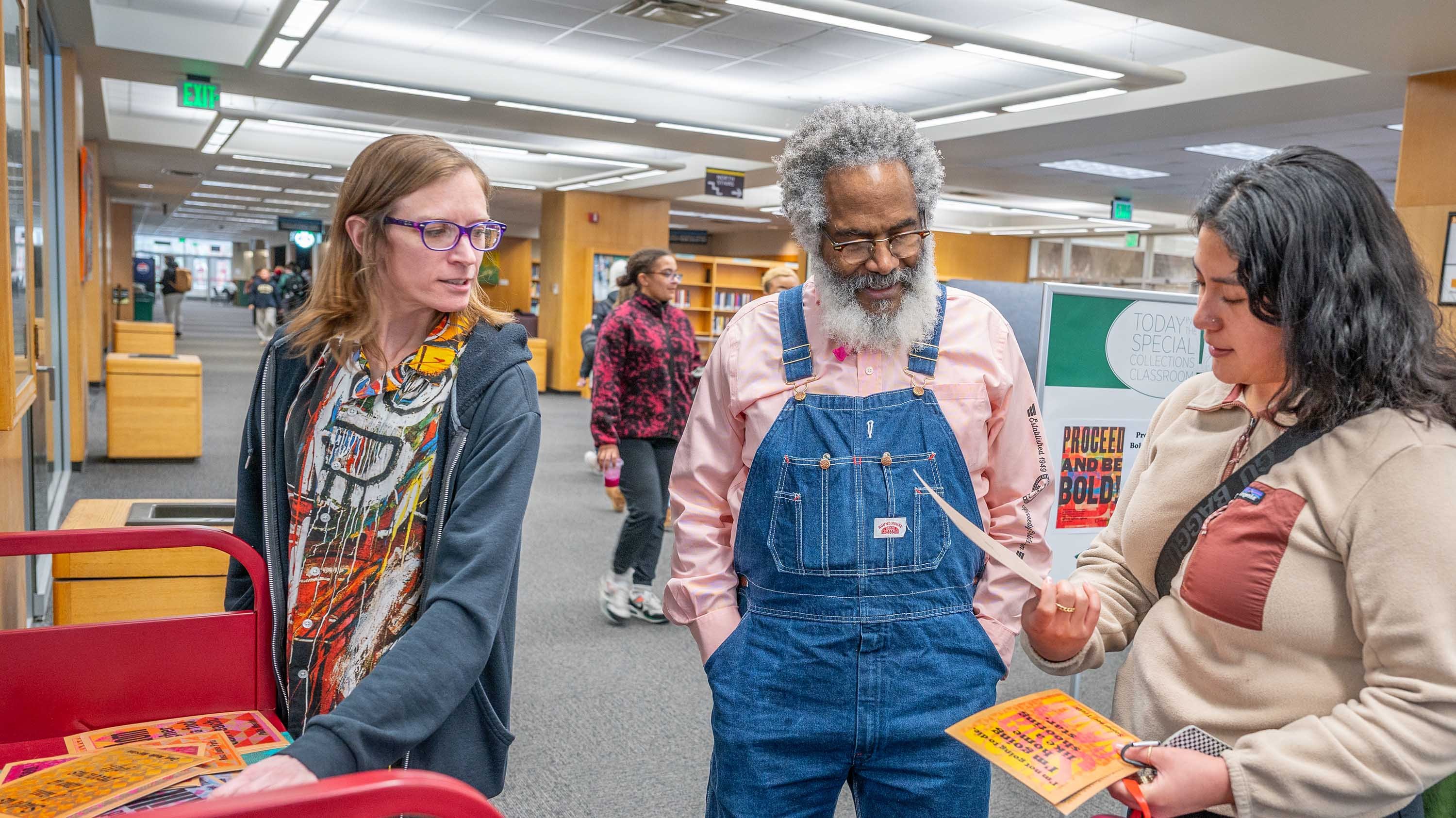 Amos Paul Kennedy Jr. interacting with students in MSU Main Library