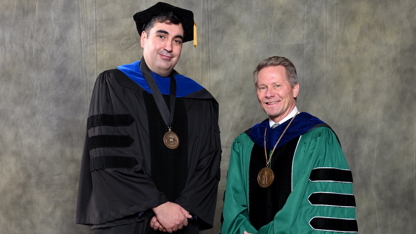 Endowed faculty member Angel Abuelo with MSU President Kevin Guskiewicz.