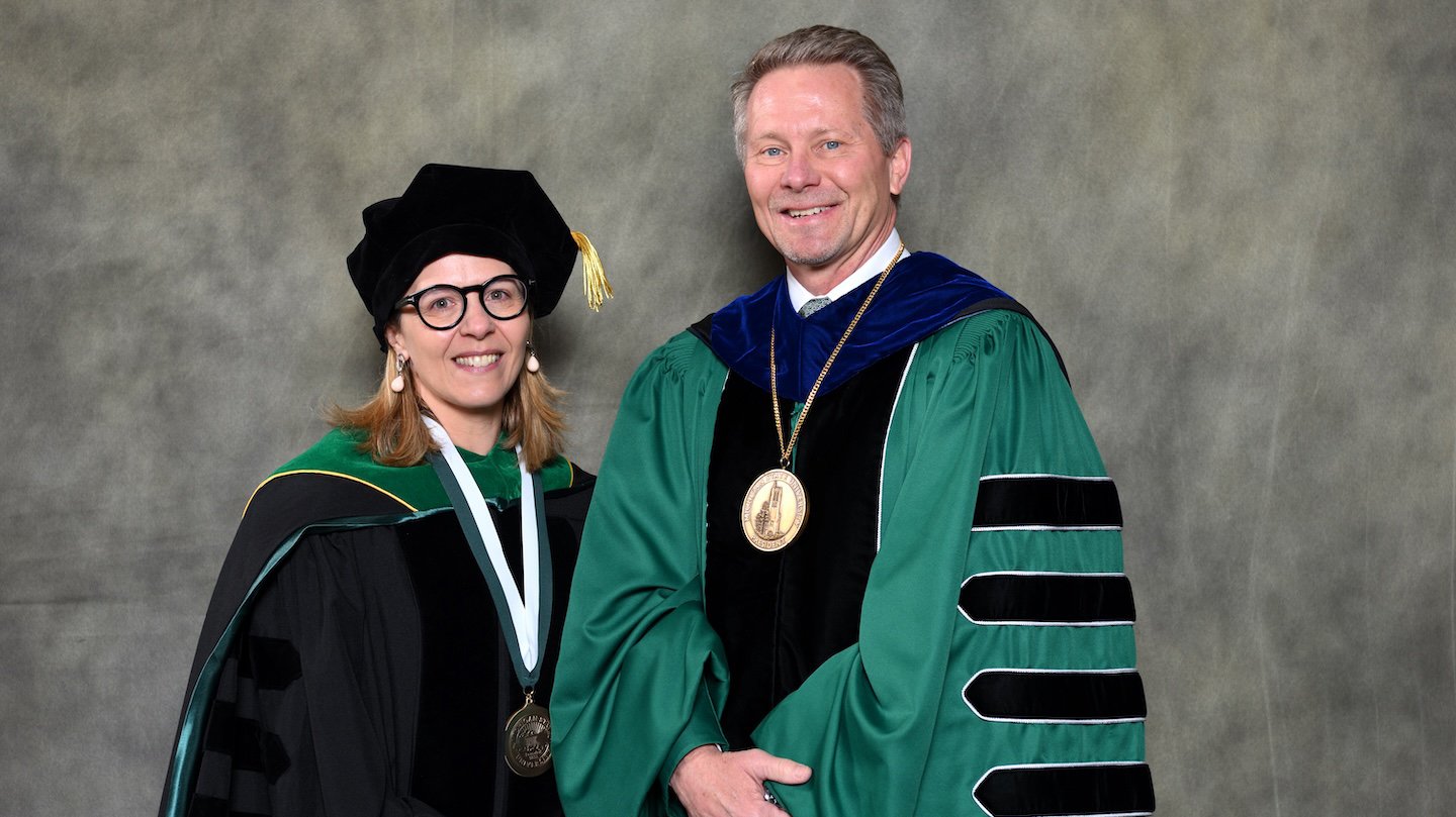Endowed faculty member Vincenzina Caputo with MSU President Kevin Guskiewicz.