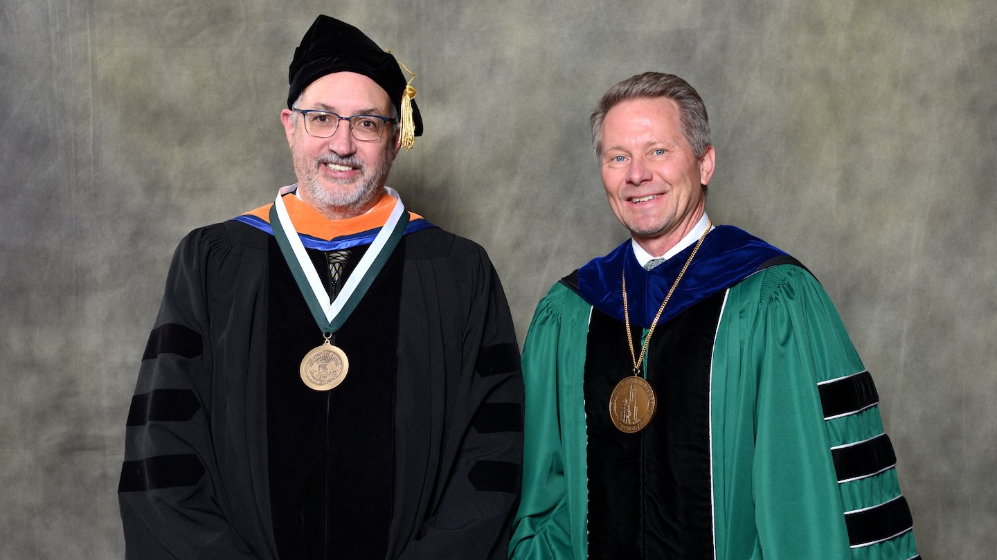 Endowed faculty member Andre Benard with MSU President Kevin Guskiewicz.