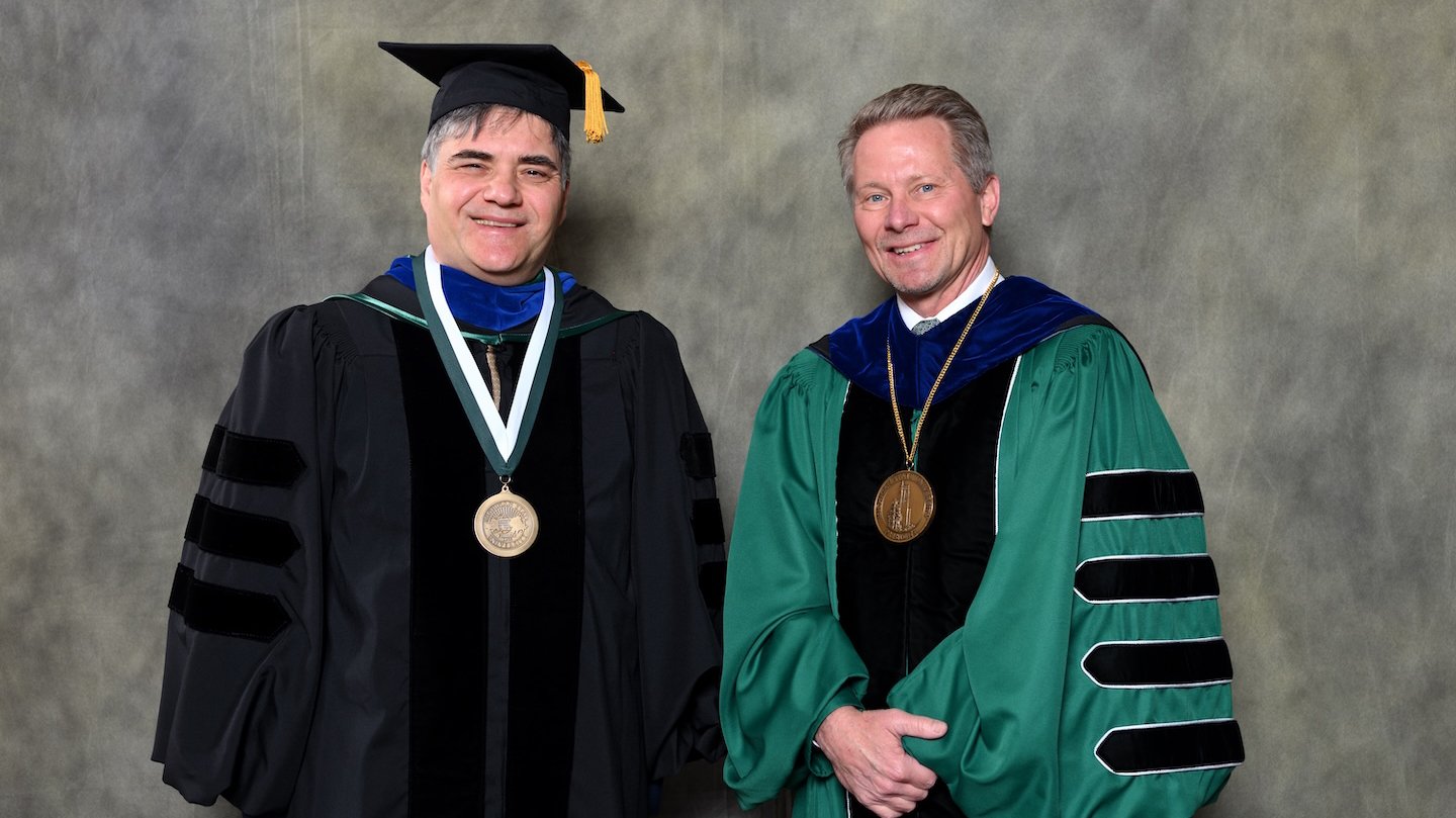 Endowed faculty member Pavel Nadolsky with MSU President Kevin Guskiewicz.