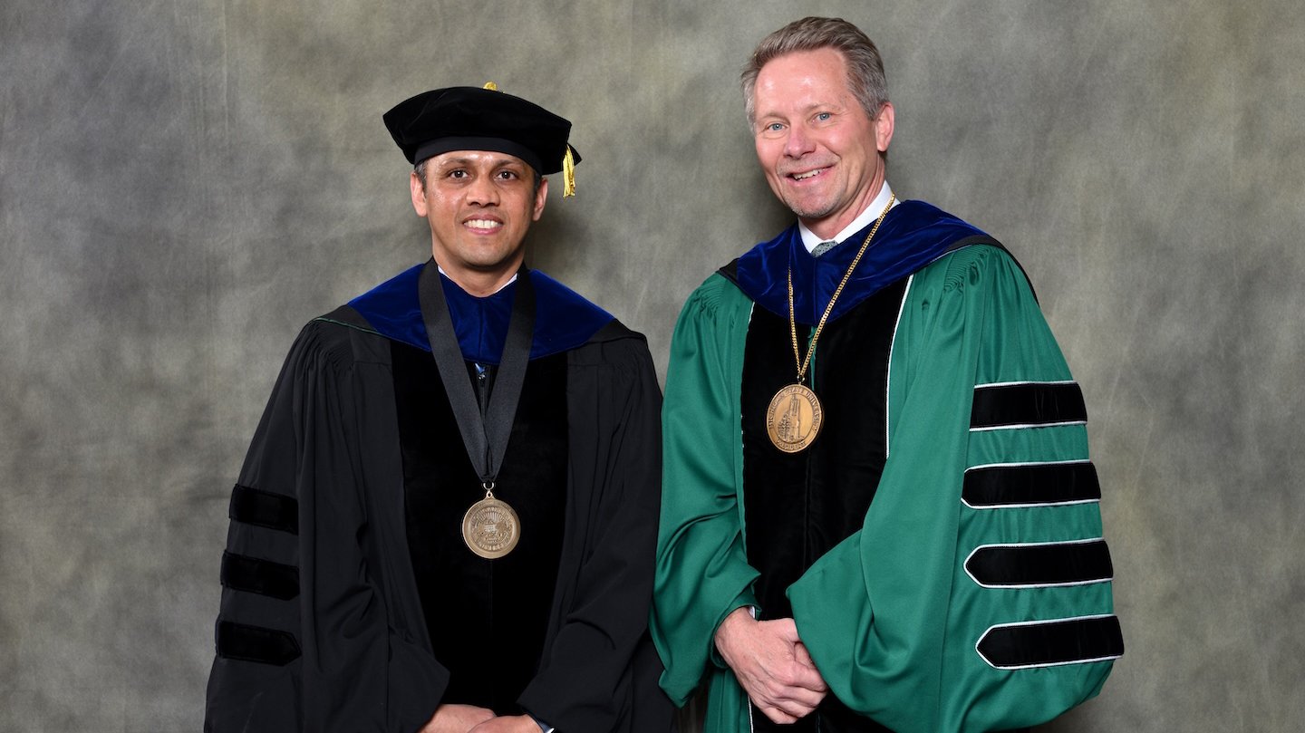 Endowed faculty member Yadu Pokhrel with MSU President Kevin Guskiewicz.