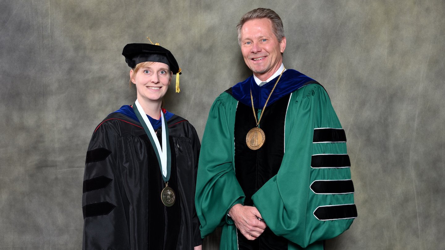 Endowed faculty member Simone Peinkofer with MSU President Kevin Guskiewicz.