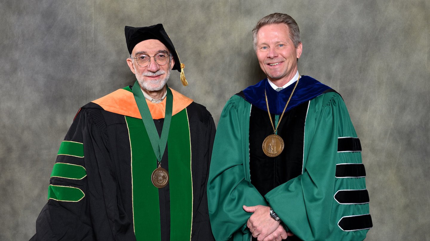 Endowed faculty member Hayder Radha with MSU President Kevin Guskiewicz.
