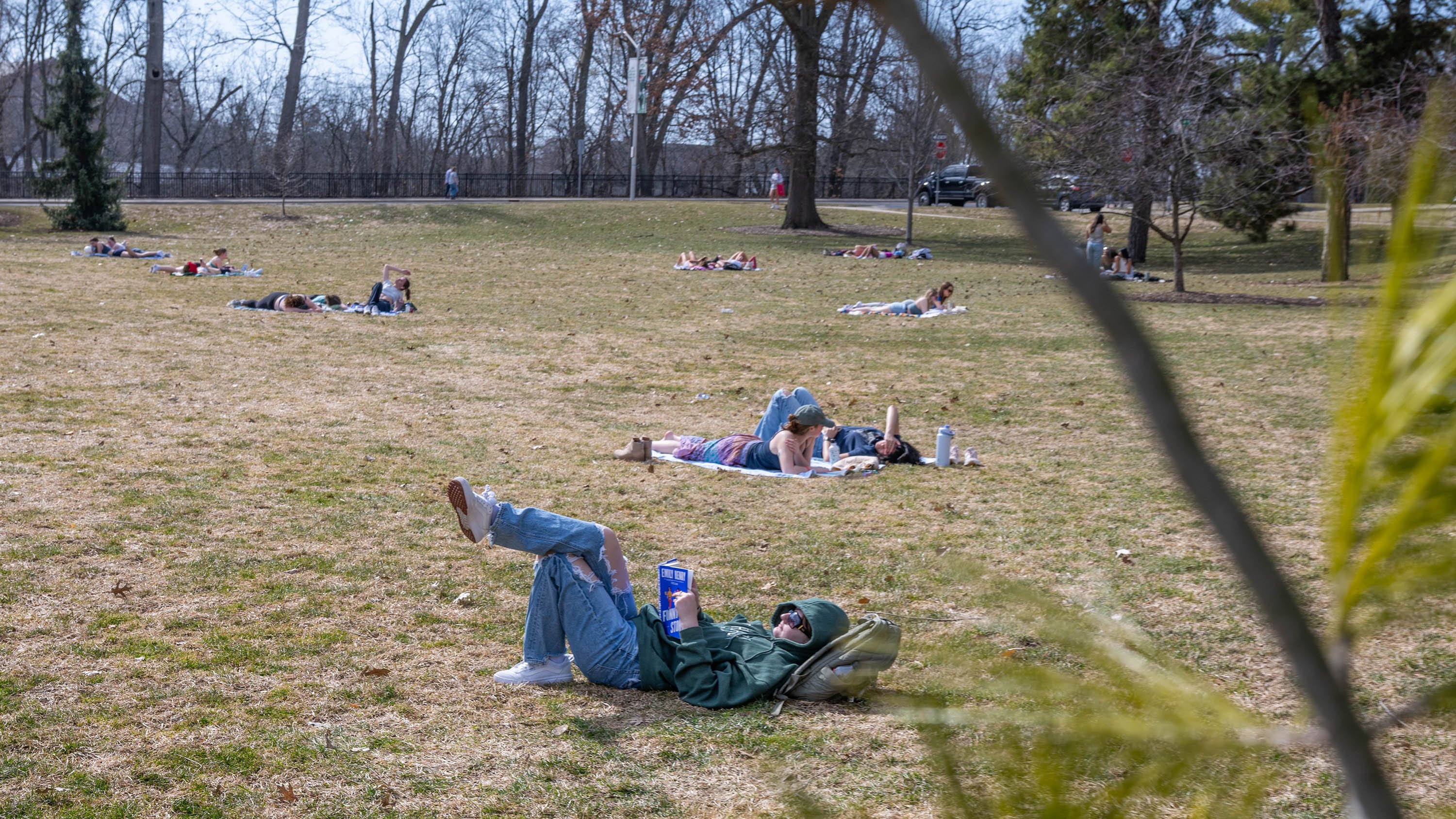 Students laying out on Adams Field