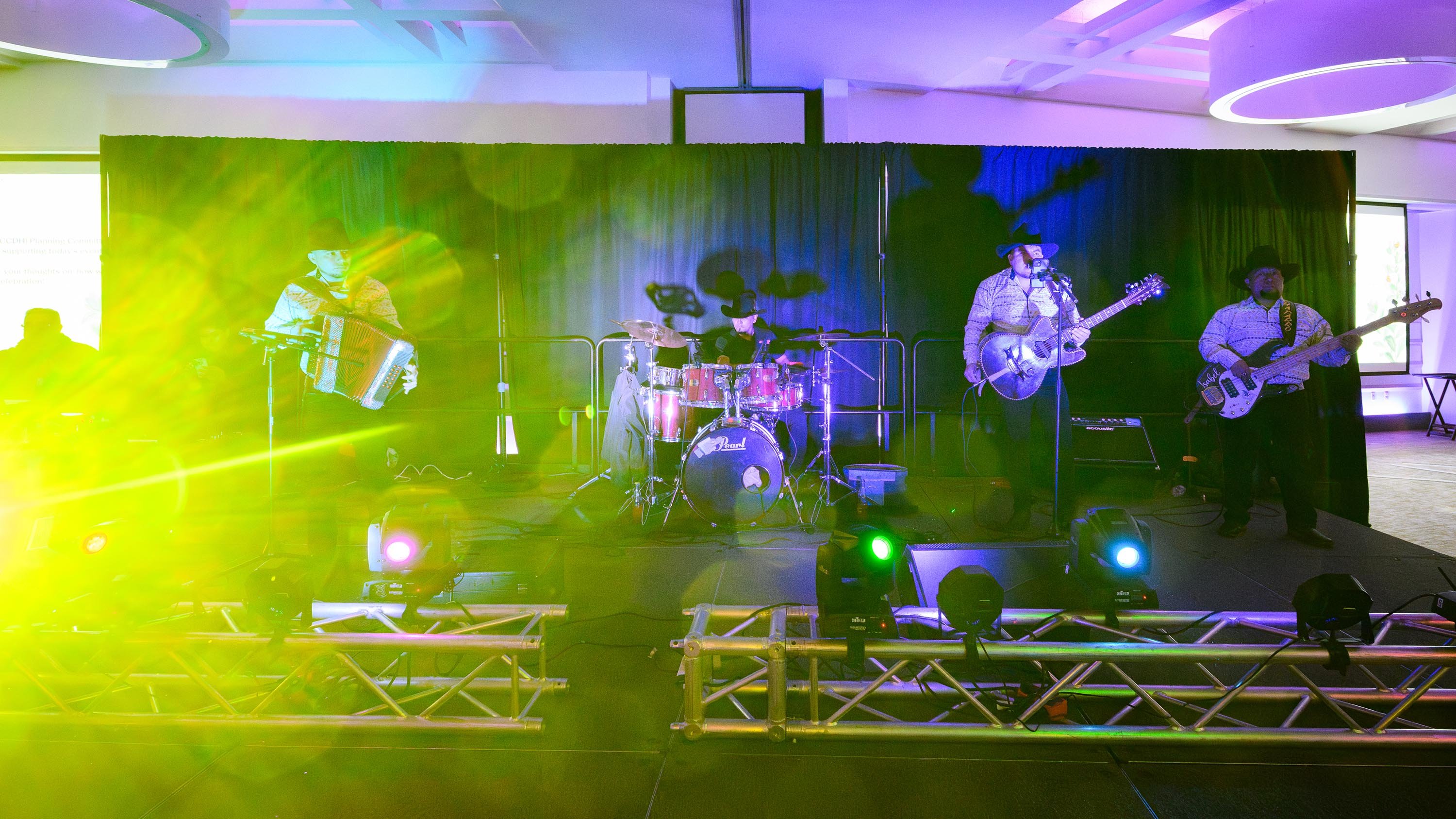 Musicians playing music on a stage
