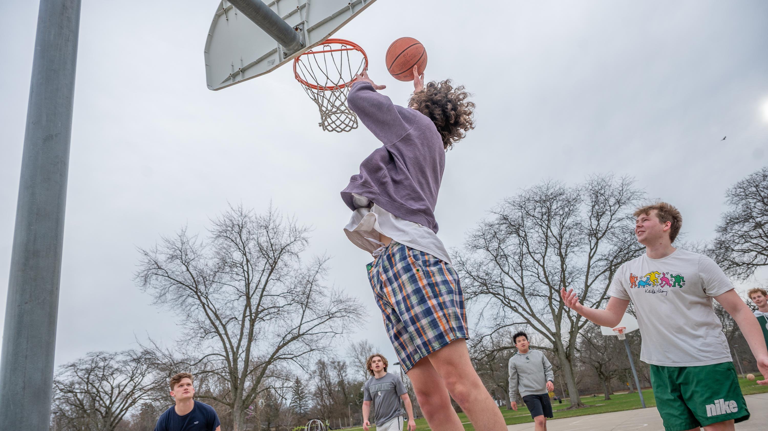Students playing basketball