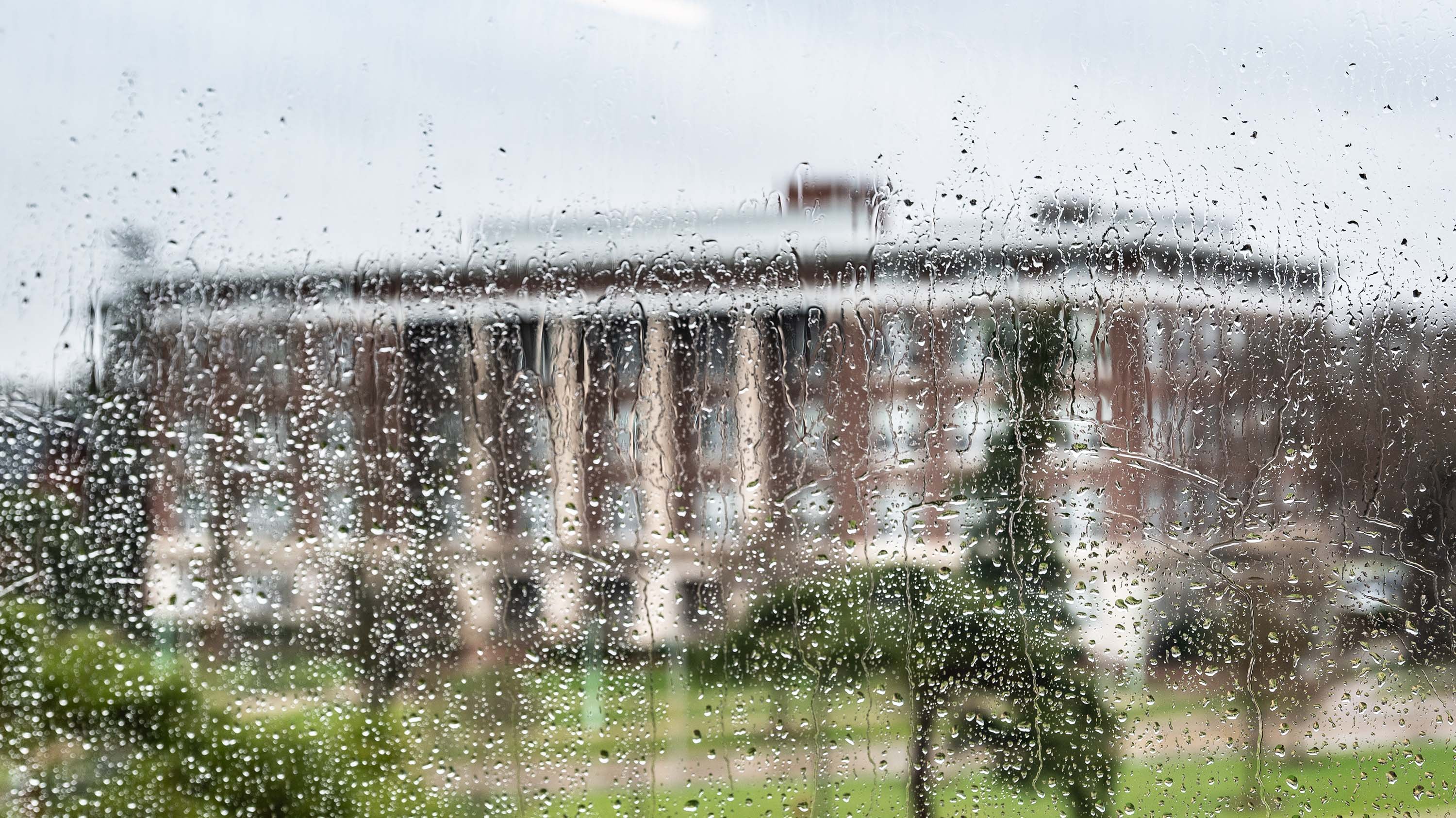 View of Agriculture Hall from rainy window