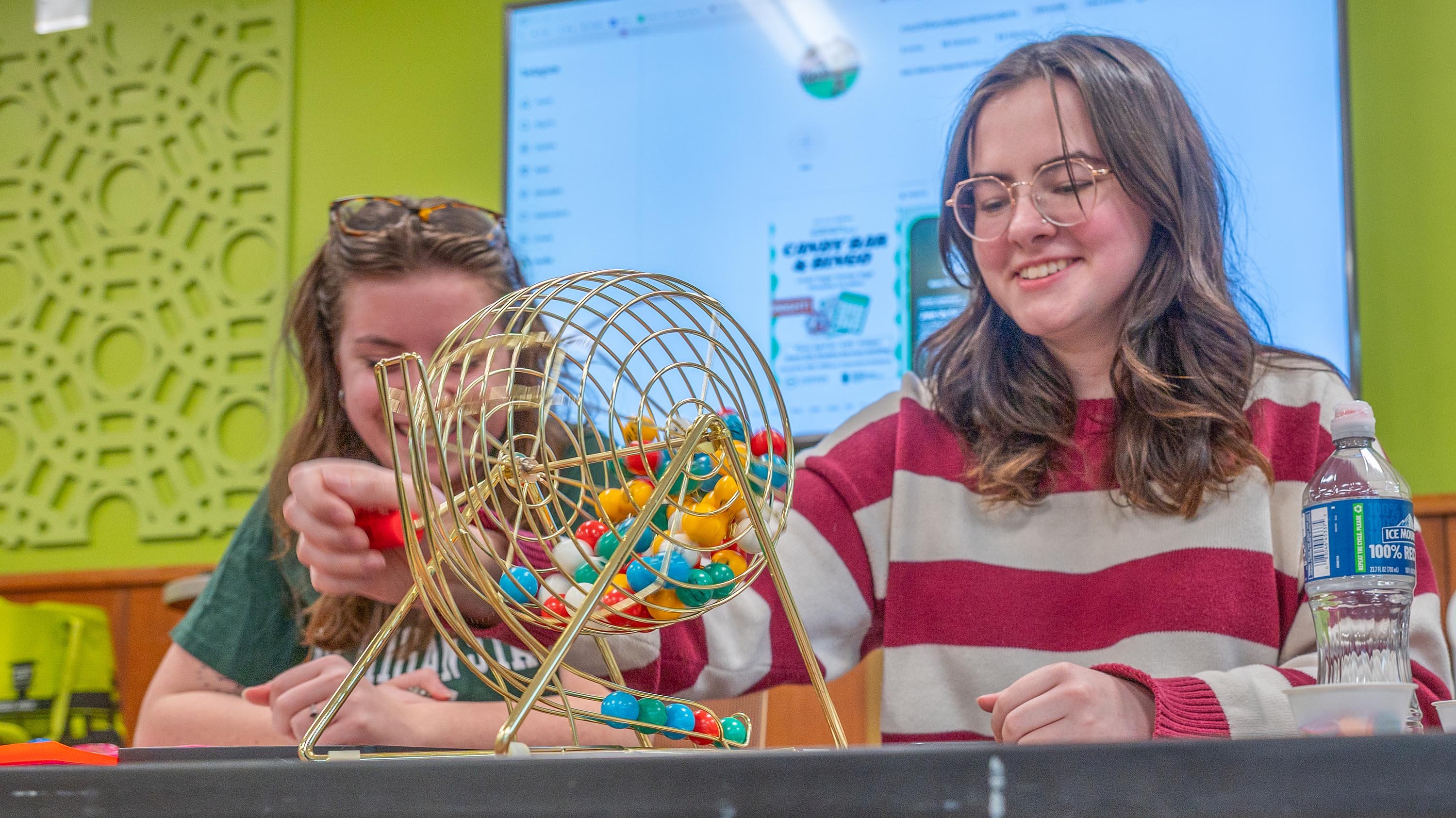 Students rolling a bingo cage