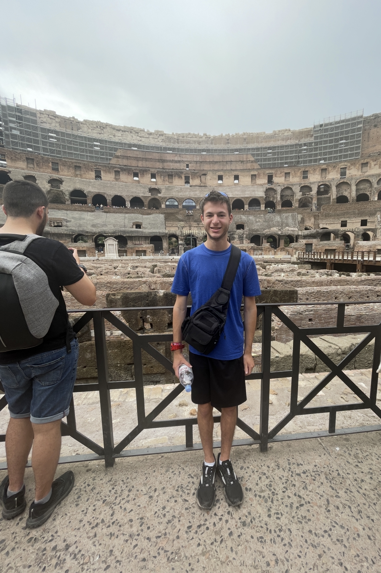 Evan poses in the Colosseum during his 2022 study abroad trip focused on sports media in Paris and Rome.