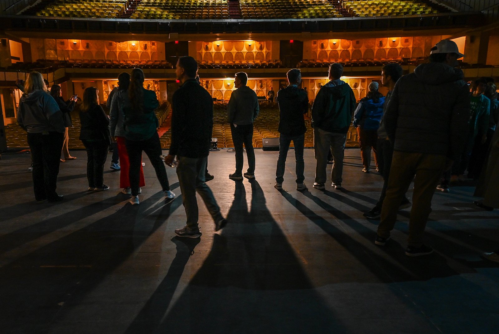 Shadows of people on stage