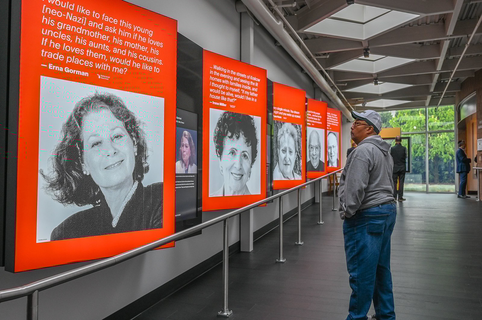 A man walks through a museum exhibition.