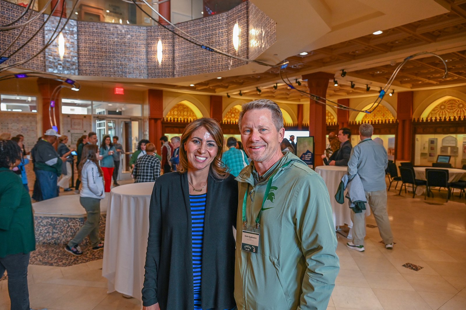 A man and woman pose for a photo.